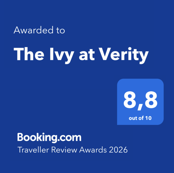 Award plaque with blue background indicating 'Awarded to The Ivy at Verity' from Booking.com, part of the Traveller Review Awards 2023, with a rating of 8.9 out of 10.