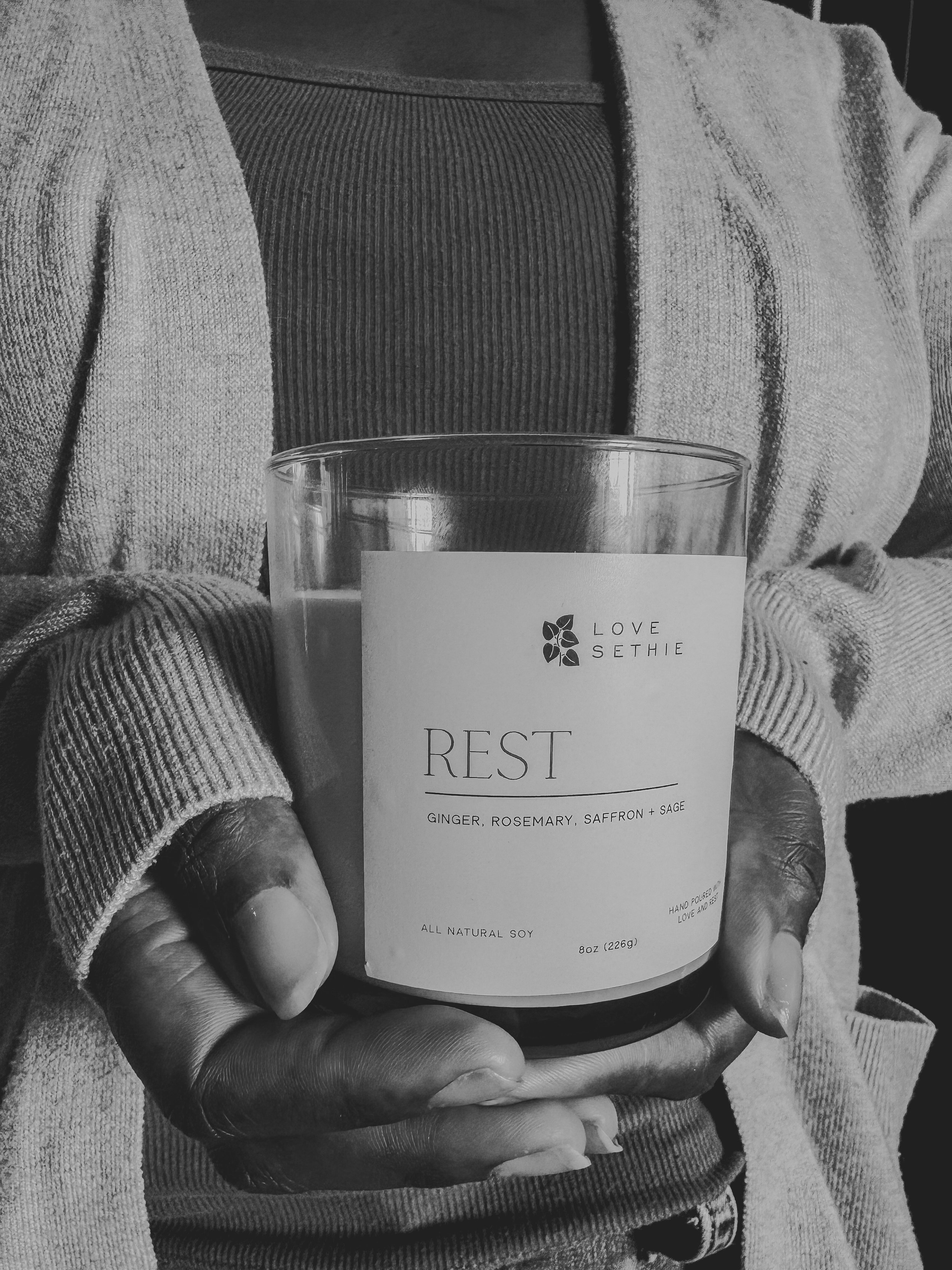 Hands holding candle