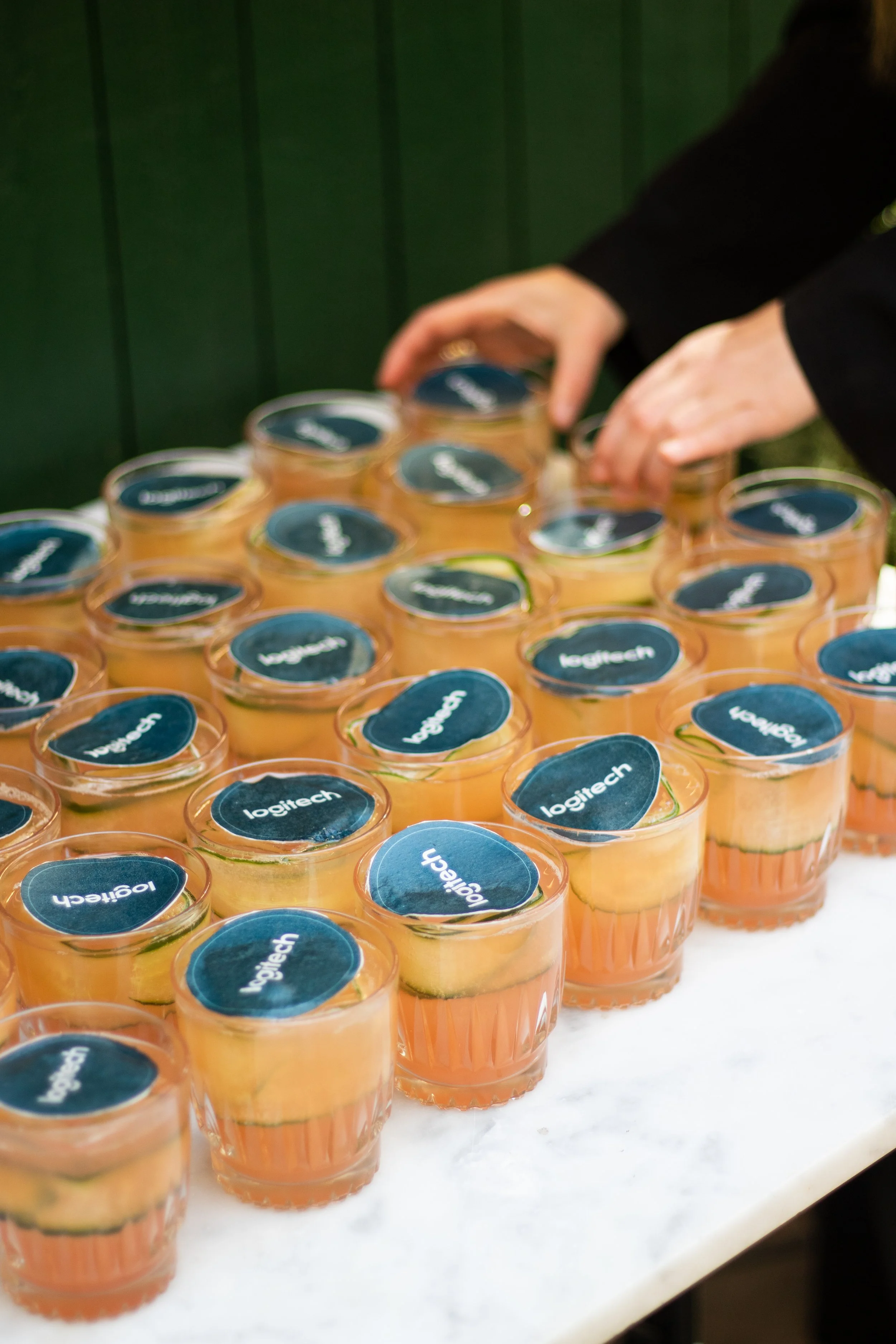 Event photography in Stockholm. Outside venue, sunny after-work event for a tech-company. Swedish influencer hosting with branded drinks and goodie-bags for guests. 