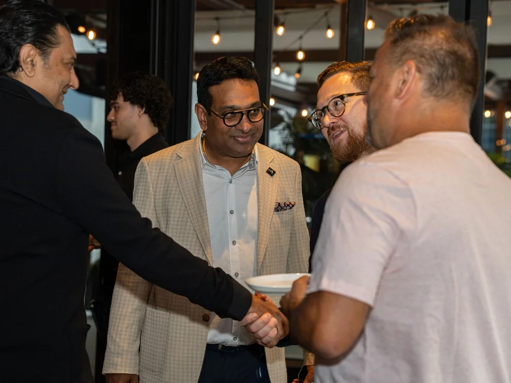 Guests shaking hands at the evening reception