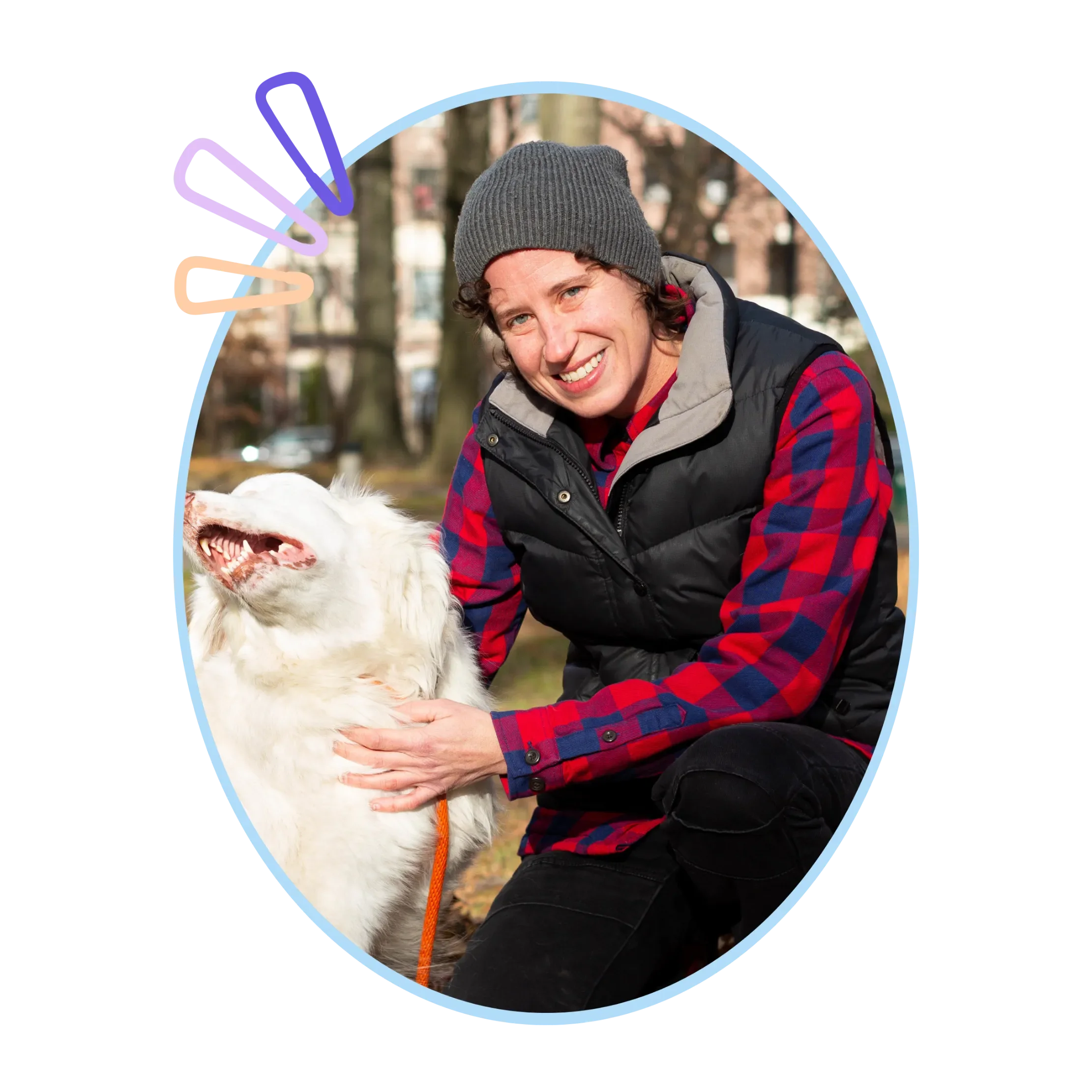 Manhattan dog trainer Claire petting a white dog in an NYC park