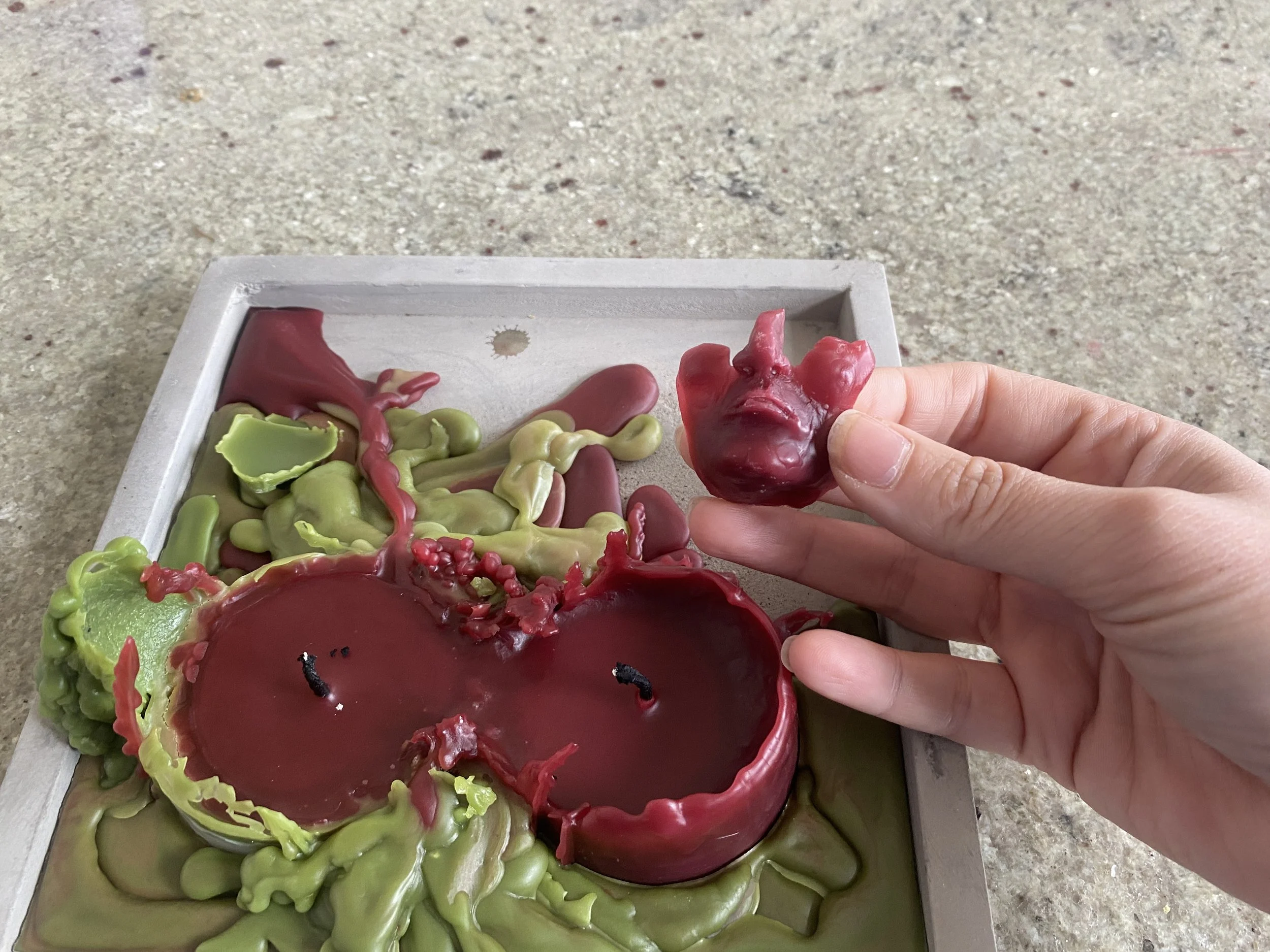 September 16, 2023 - After the melt test.  The wax pooled everywhere and only the lower part of the face remained.  (This is where Vast and Trunkless came from)