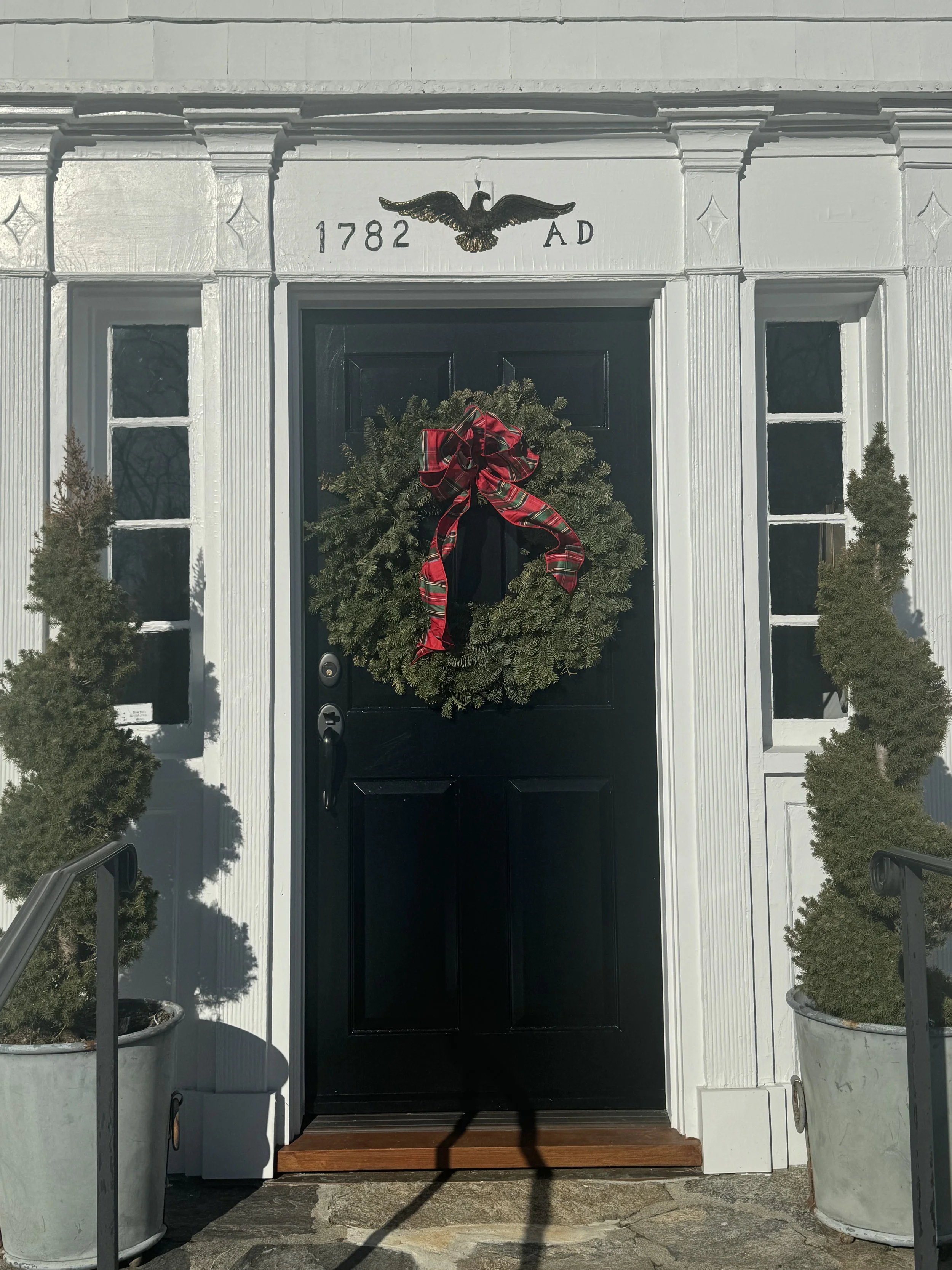Cliff Walk Designs replaced the eagle above the doorway which before housed a larger gold bird. 