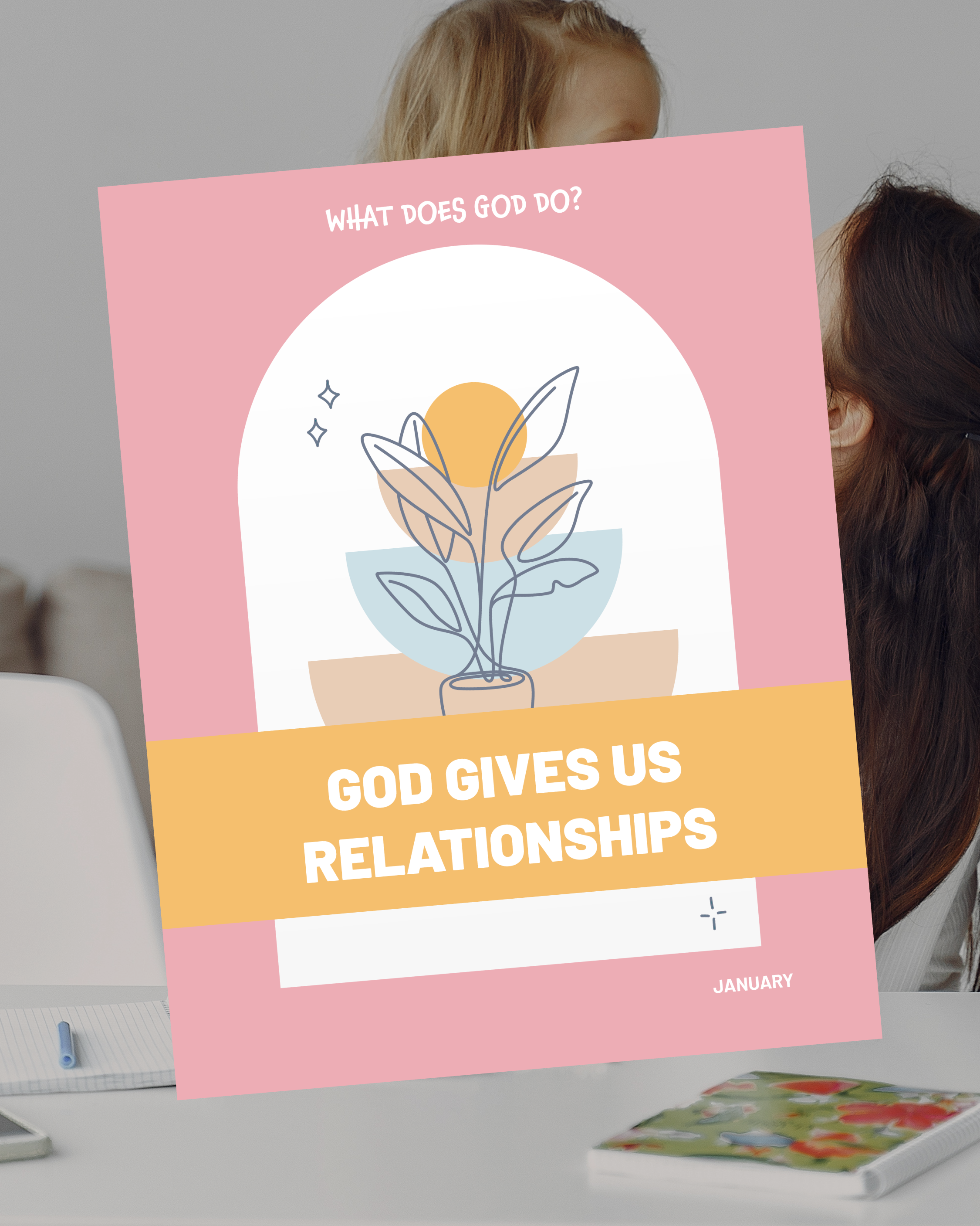A boy sitting at a table, stamping cards with ink to send to neighbors