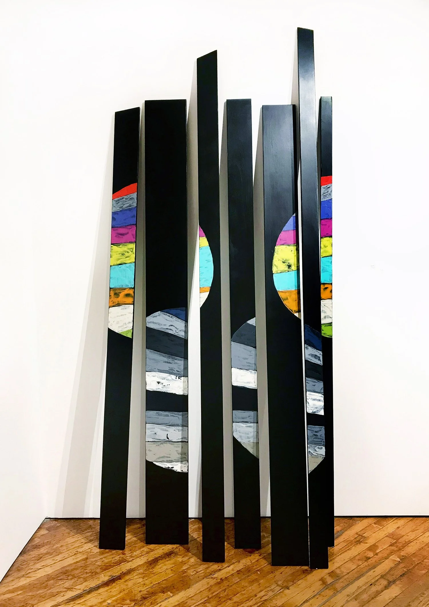 Stan Olthuis. Village, 2019. Acrylic paint on poplar wood. 114 x 36 inches (7 pieces). Gagne Contemporary. Photo by Dean Tomlinson. 