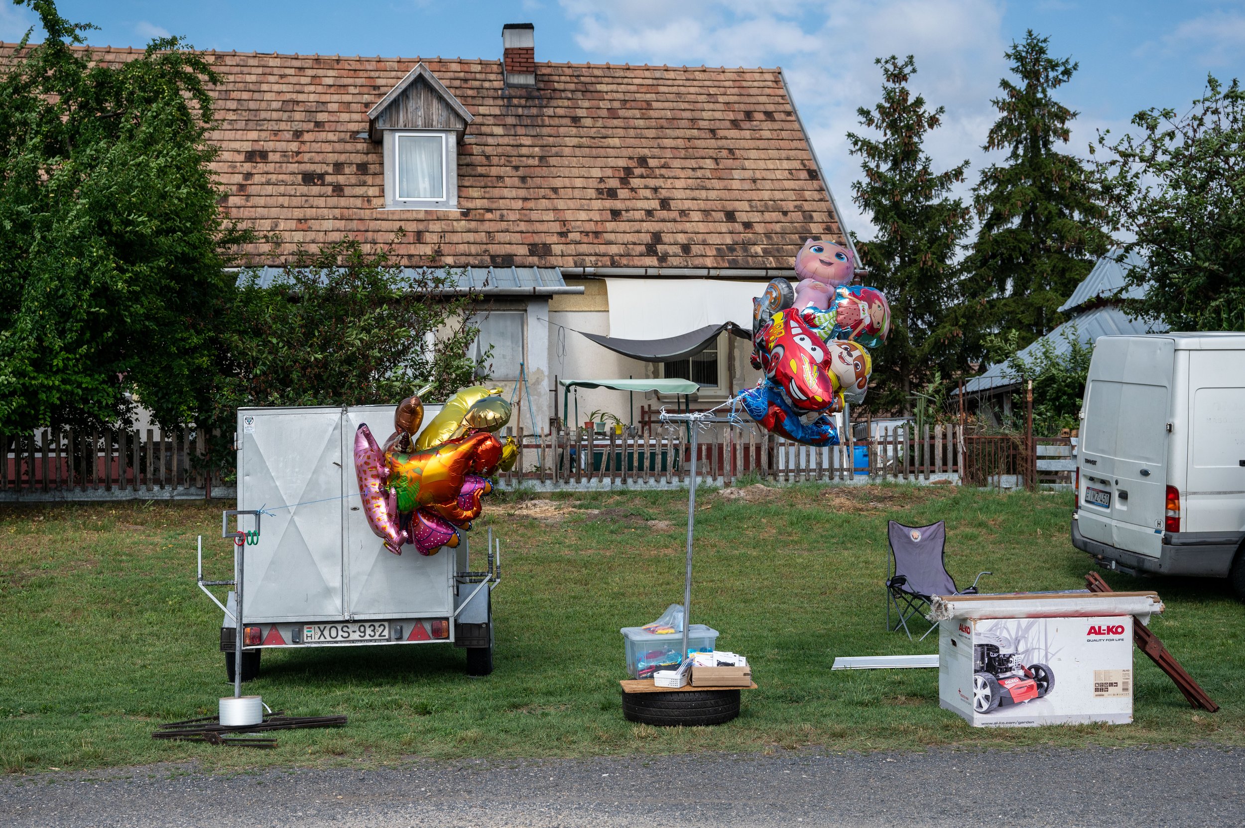 Balloon retailer at a village fair.
