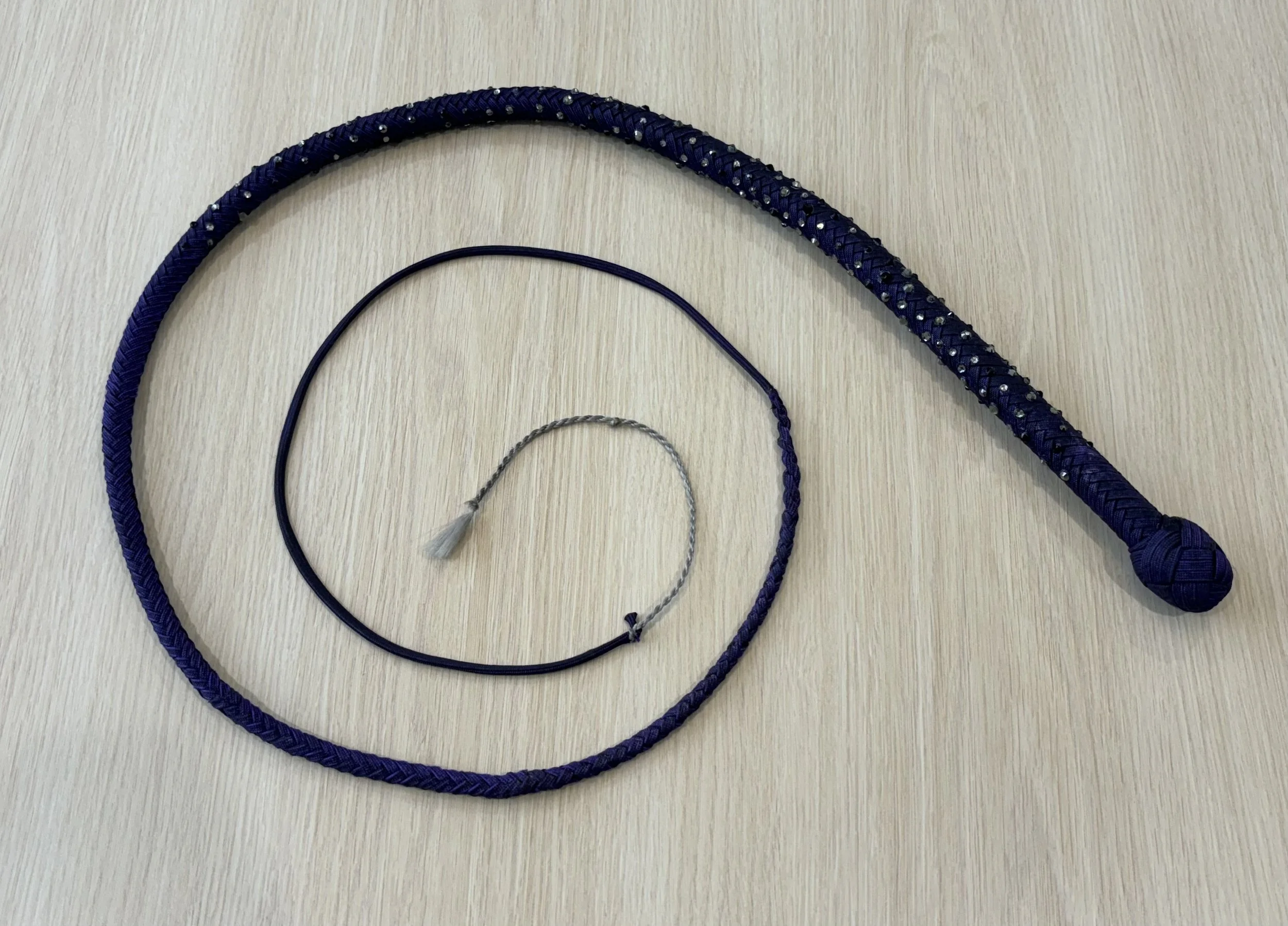 Three different types of headbands laid out on a light-colored wooden surface.