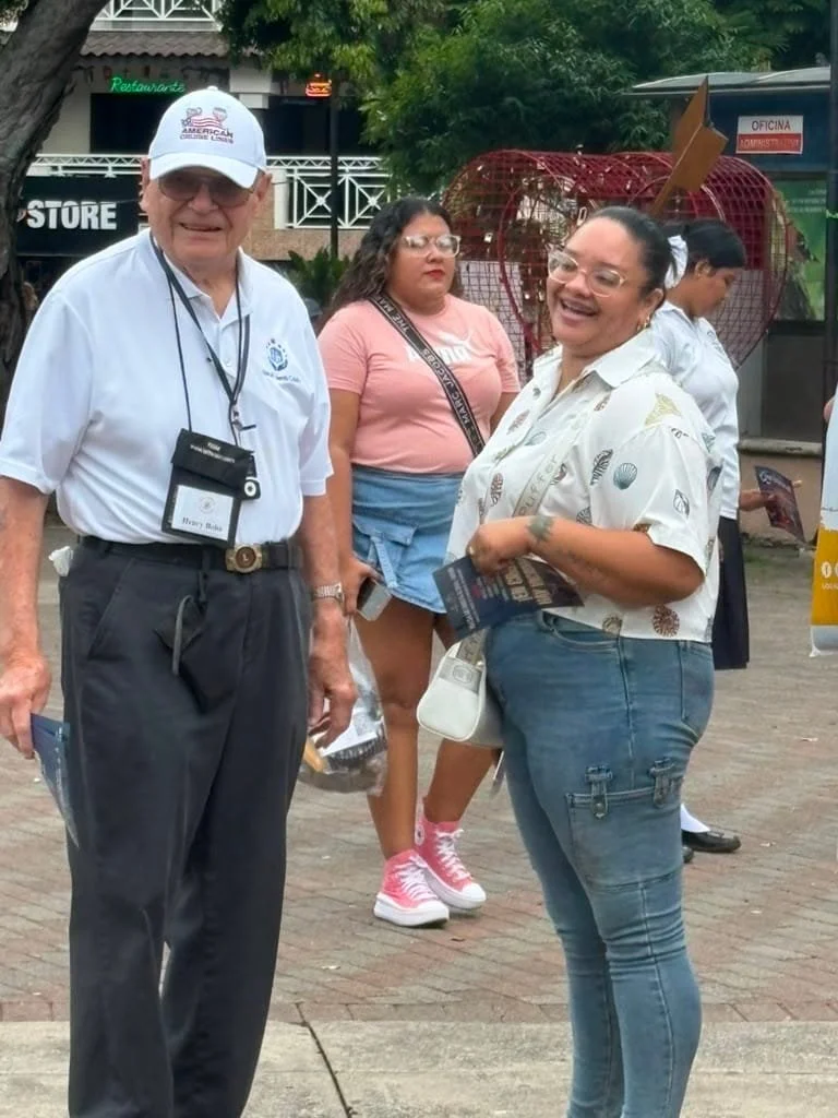 Rick Bonfim Ministries mission team member visiting with a woman during community outreach in Panama.