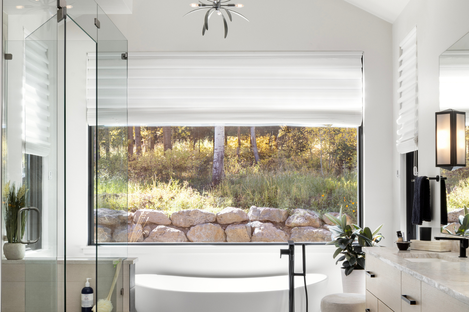 Bathroom with large window, natural light, and layered lighting illustrating how lighting shapes mood and atmosphere