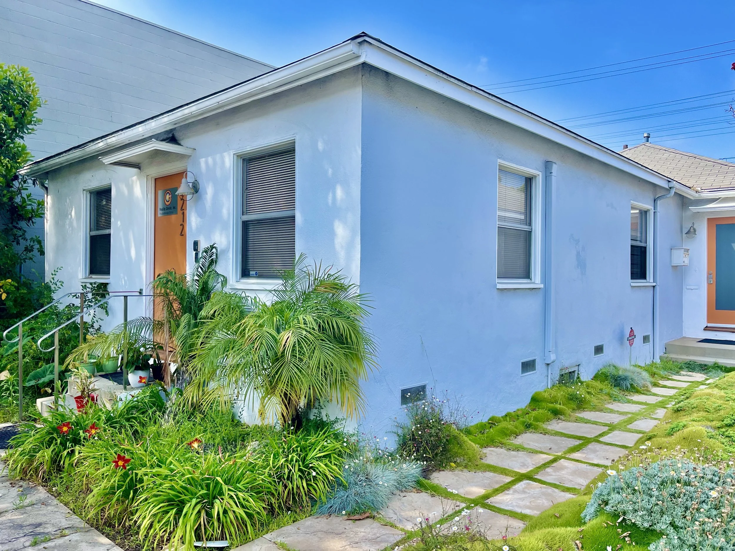 White bungalow that is home to ArtistServices in Culver City.