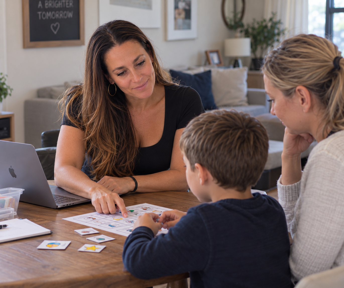 A BCBA conducts ABA therapy and parent coaching during an in-home session in Boston, MA