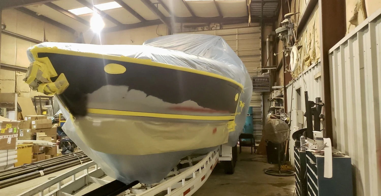 Hull masked off in the shop for gelcoat work