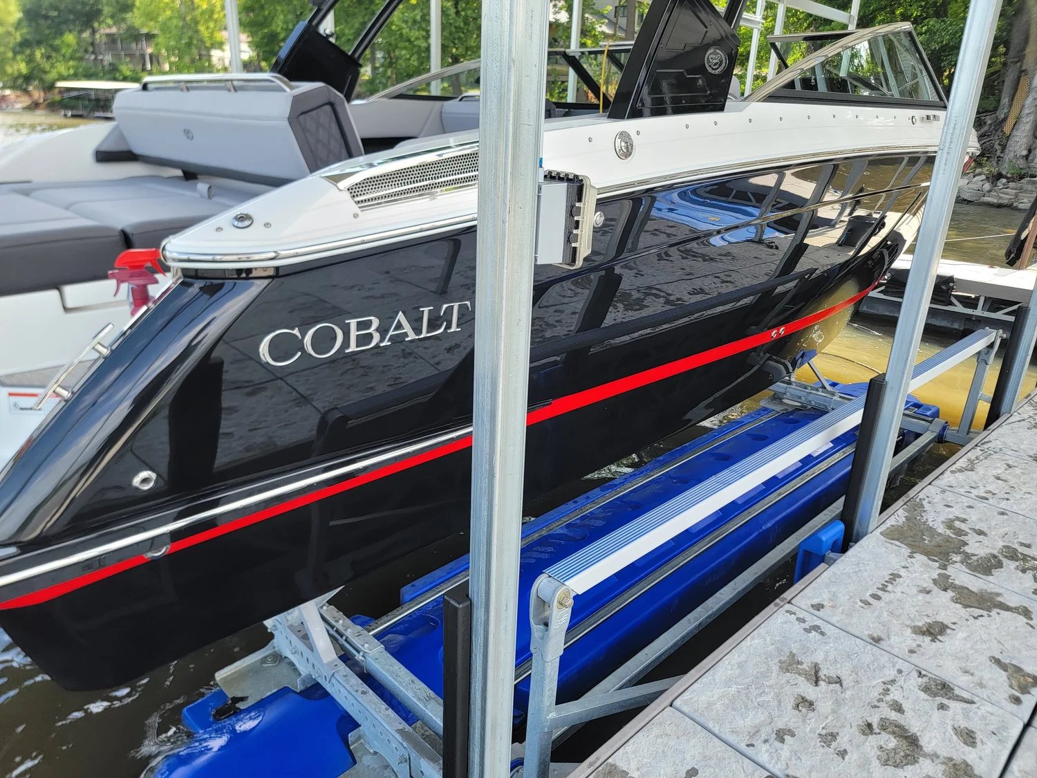 Black and red runabout on a lift after service