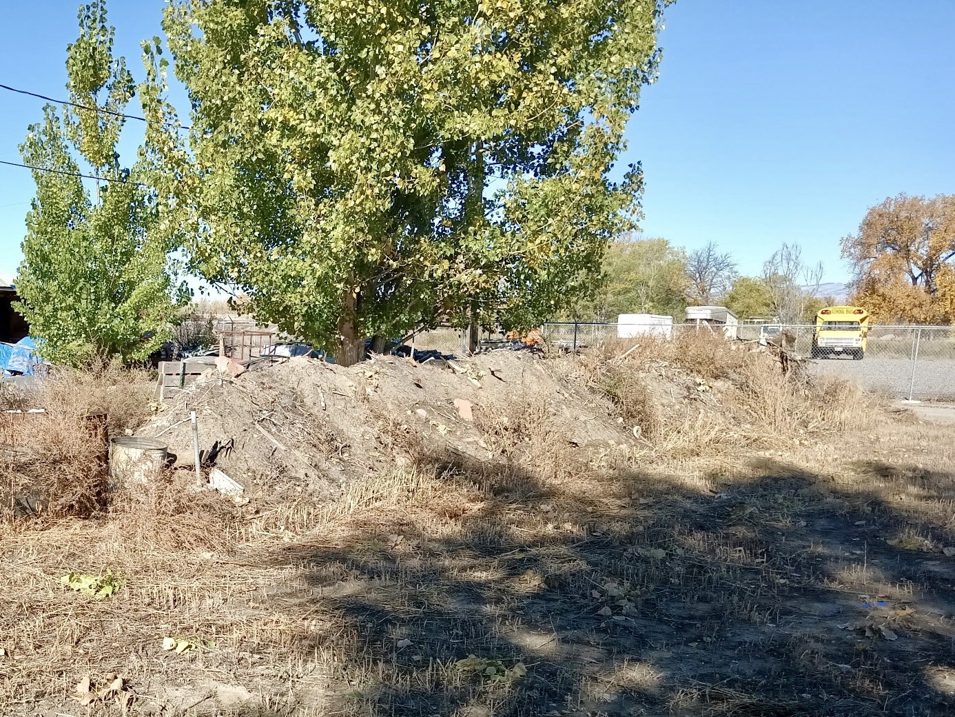 Large debris pile being cleaned up 