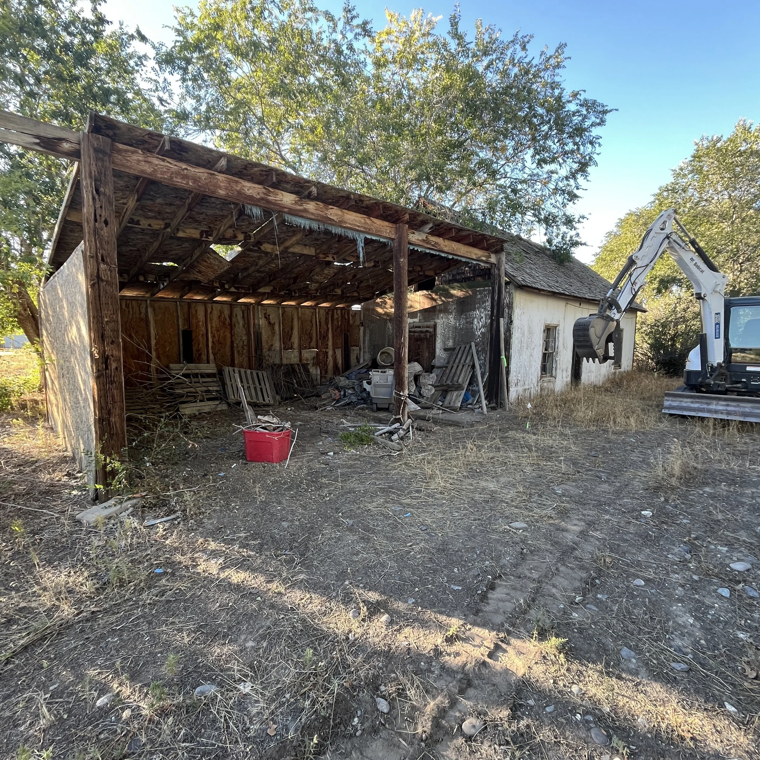 Demolition of barn with heavy equipment and cleaning up