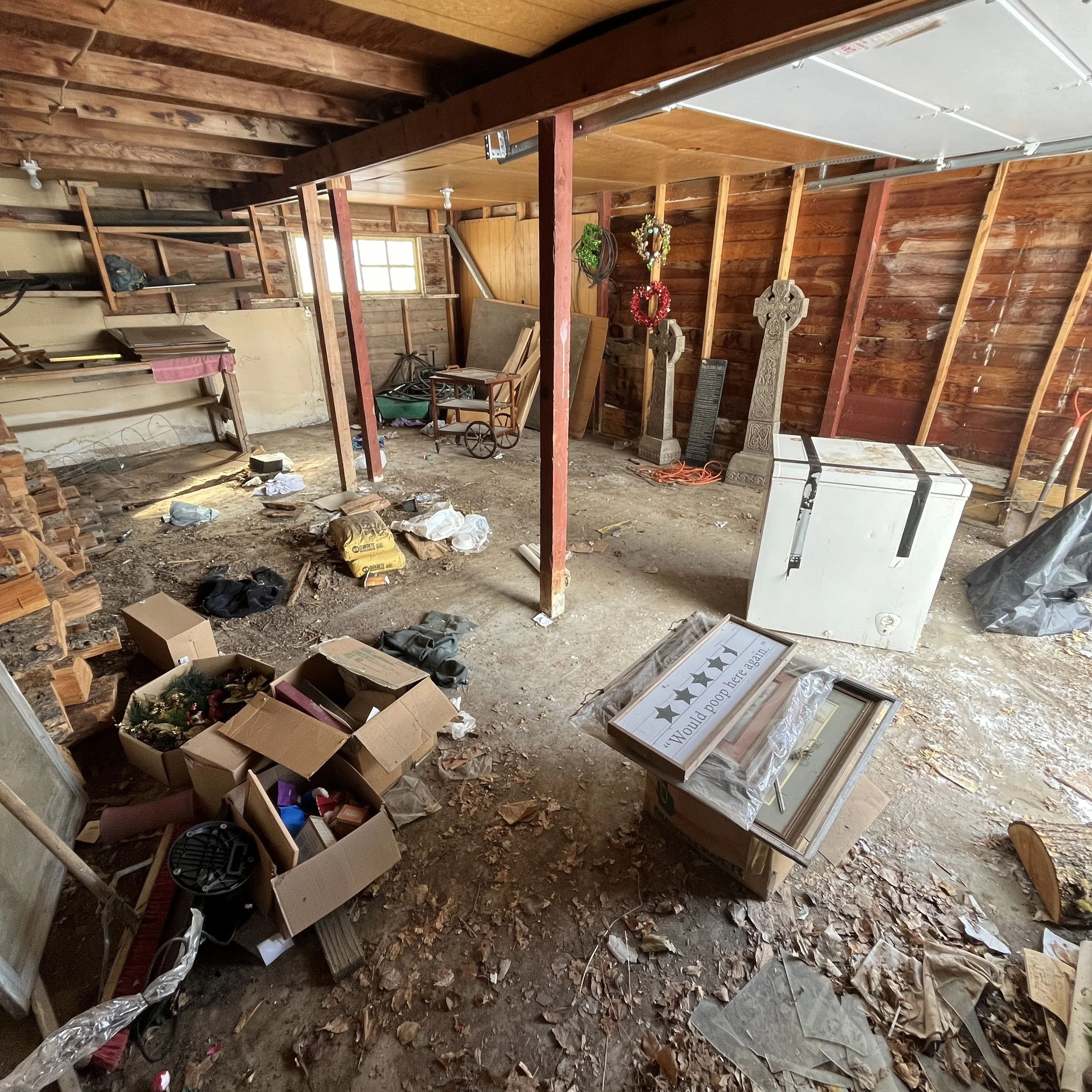 garage with a bunch of junk that's being cleaned up near Cody, WY