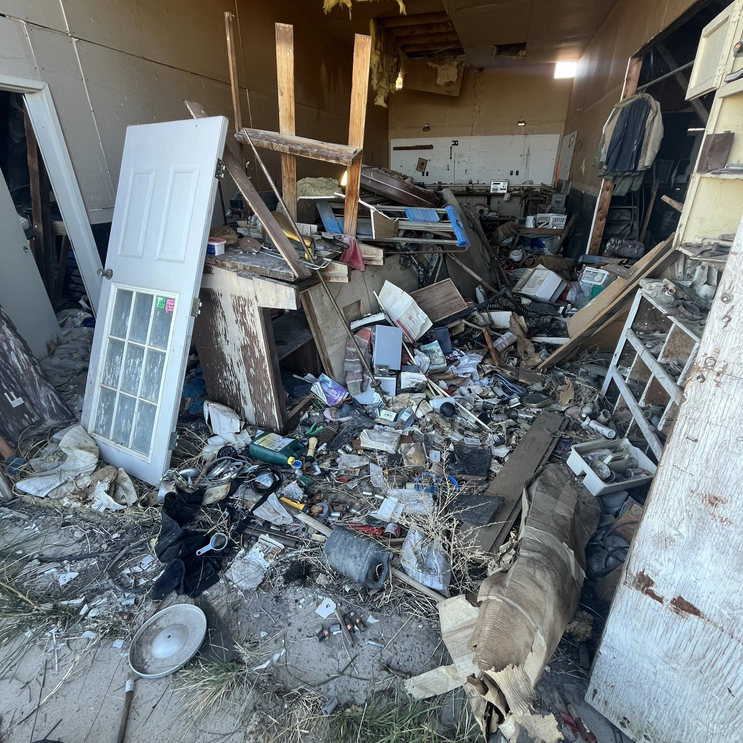 Junk and Debris being cleaned out of a barn near Cody, WY