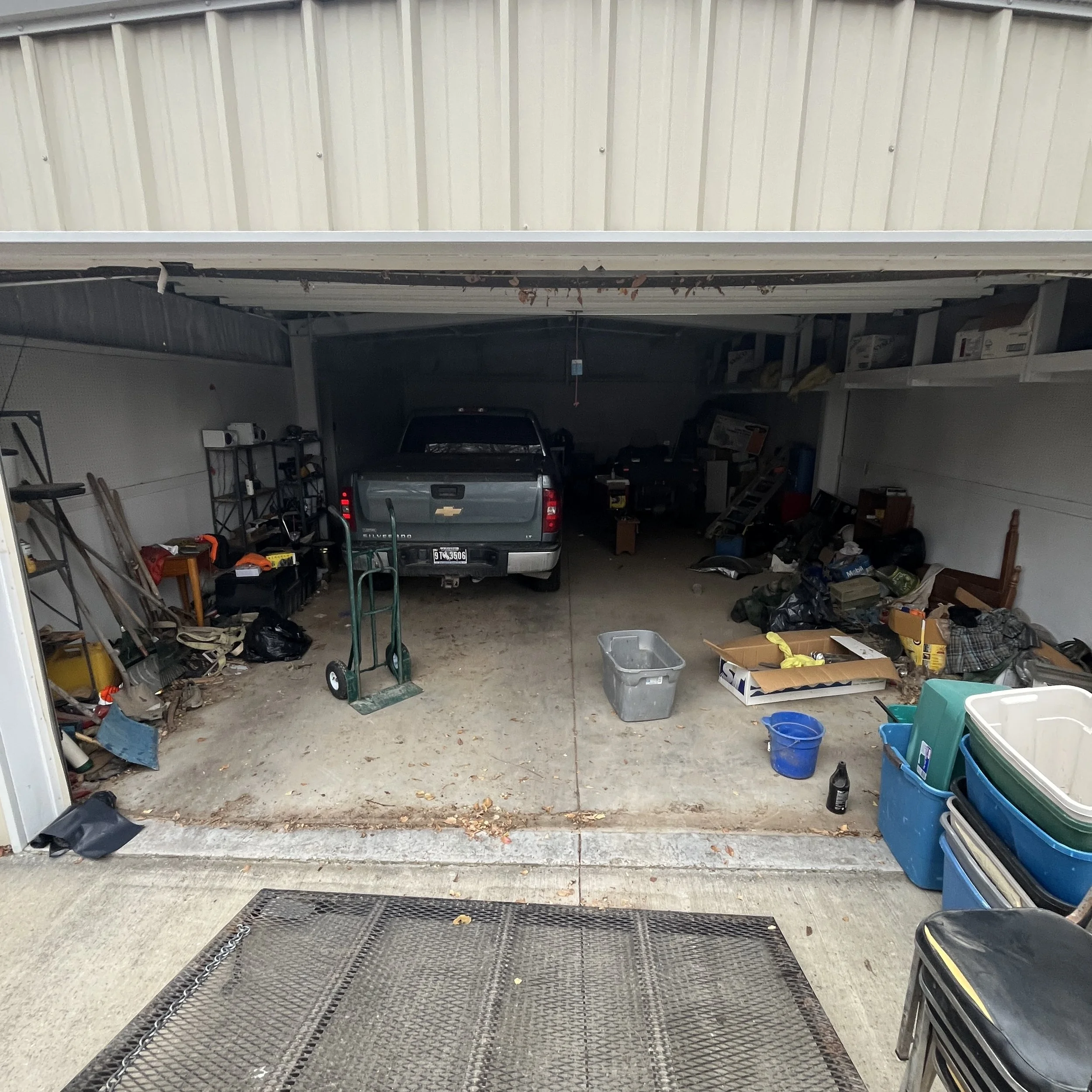 Garage that is full of junk being cleaned up in Lovell, WY