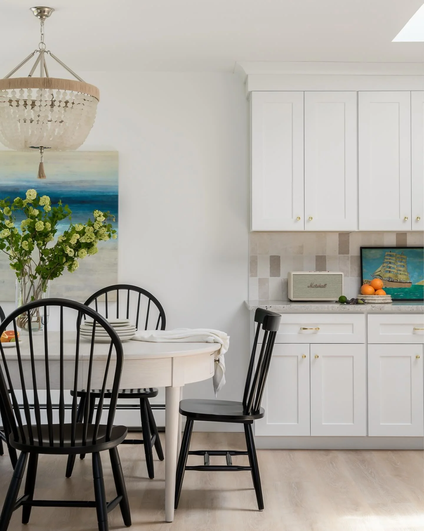 The light at the Jersey Shore in late spring.  Soft, salt-washed, a little hazy at the edges.  We wanted this kitchen to hold that feeling year round.

The abstract canvas reads like the horizon off the coast, that moment where deep water meets sky. 