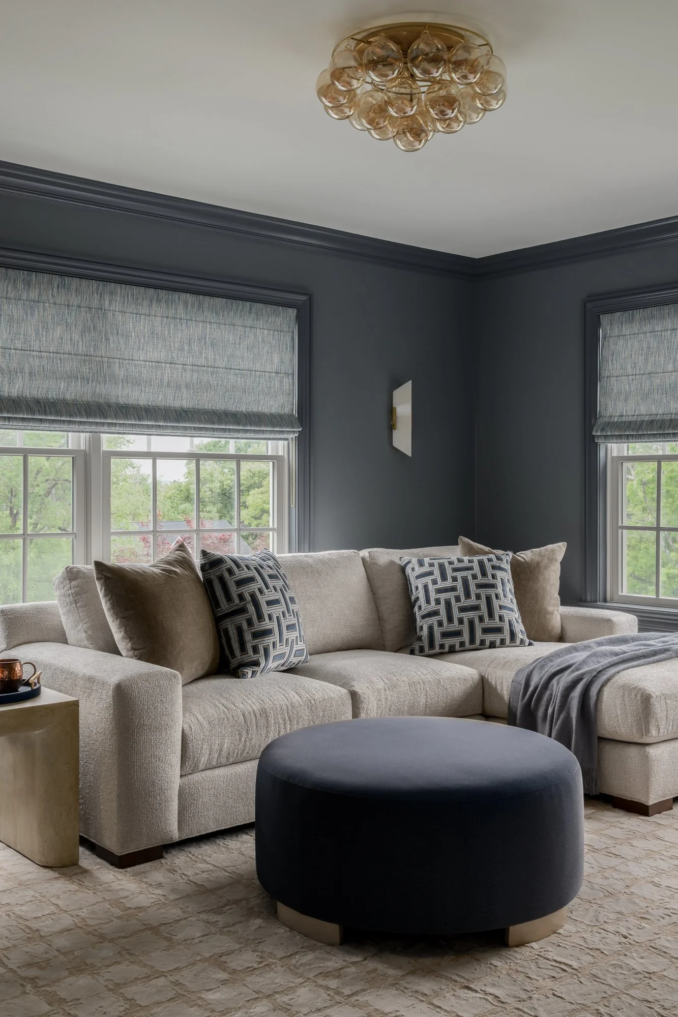 navy-blue-living-room-with-round-ottoman.jpg