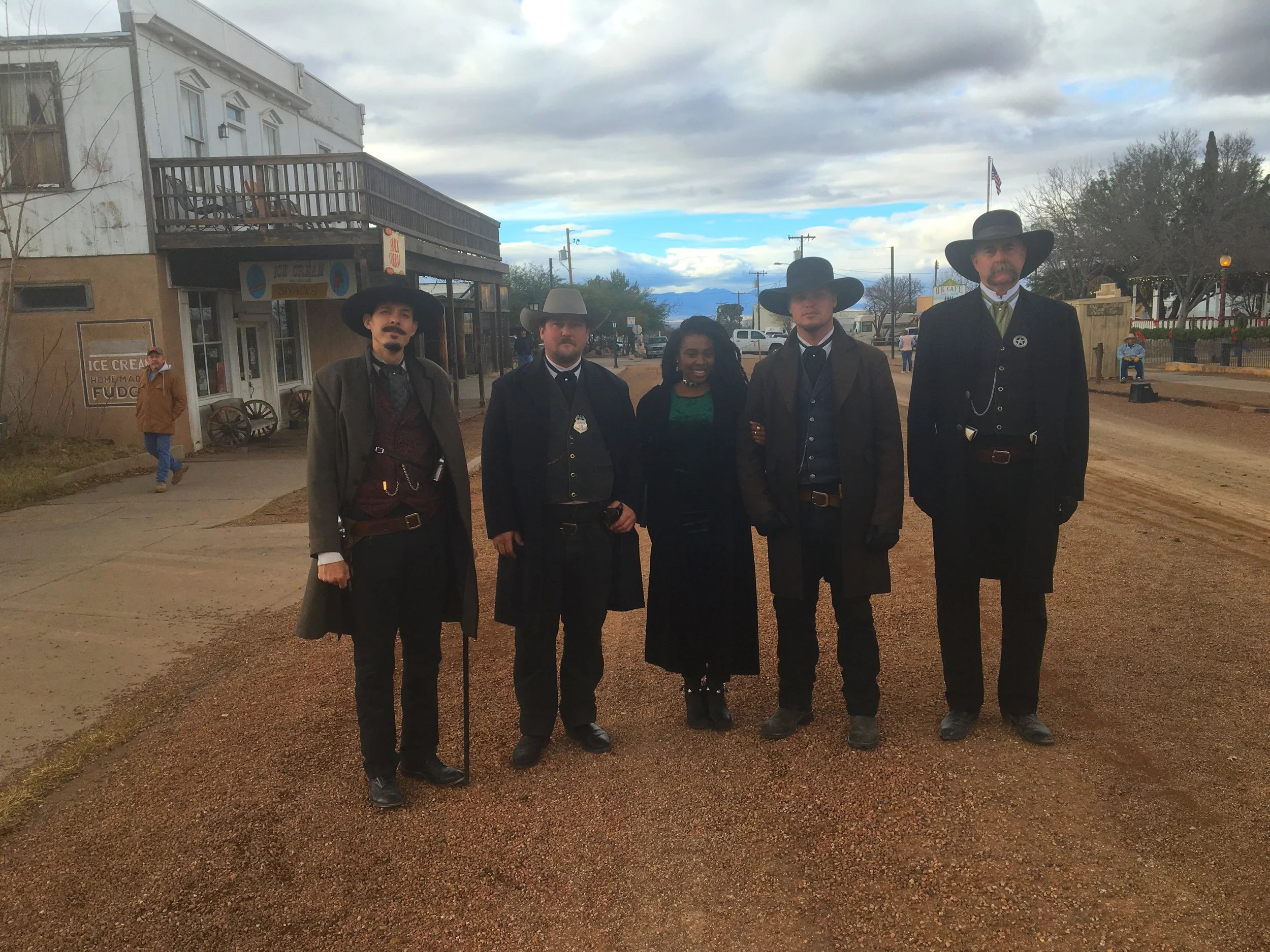 The author posing with O.K. Corral reenactment actors in Tombstone, Arizona