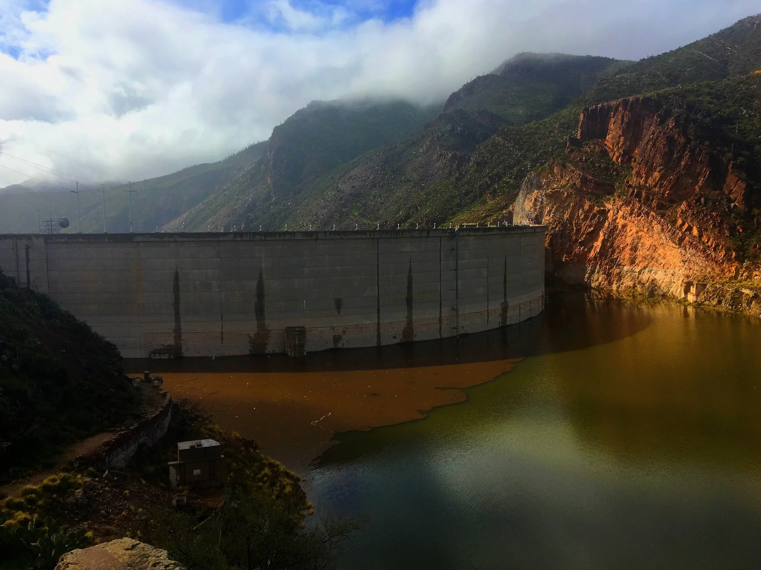 Theodore Roosevelt Dam in Arizona creating a scenic desert lake view.