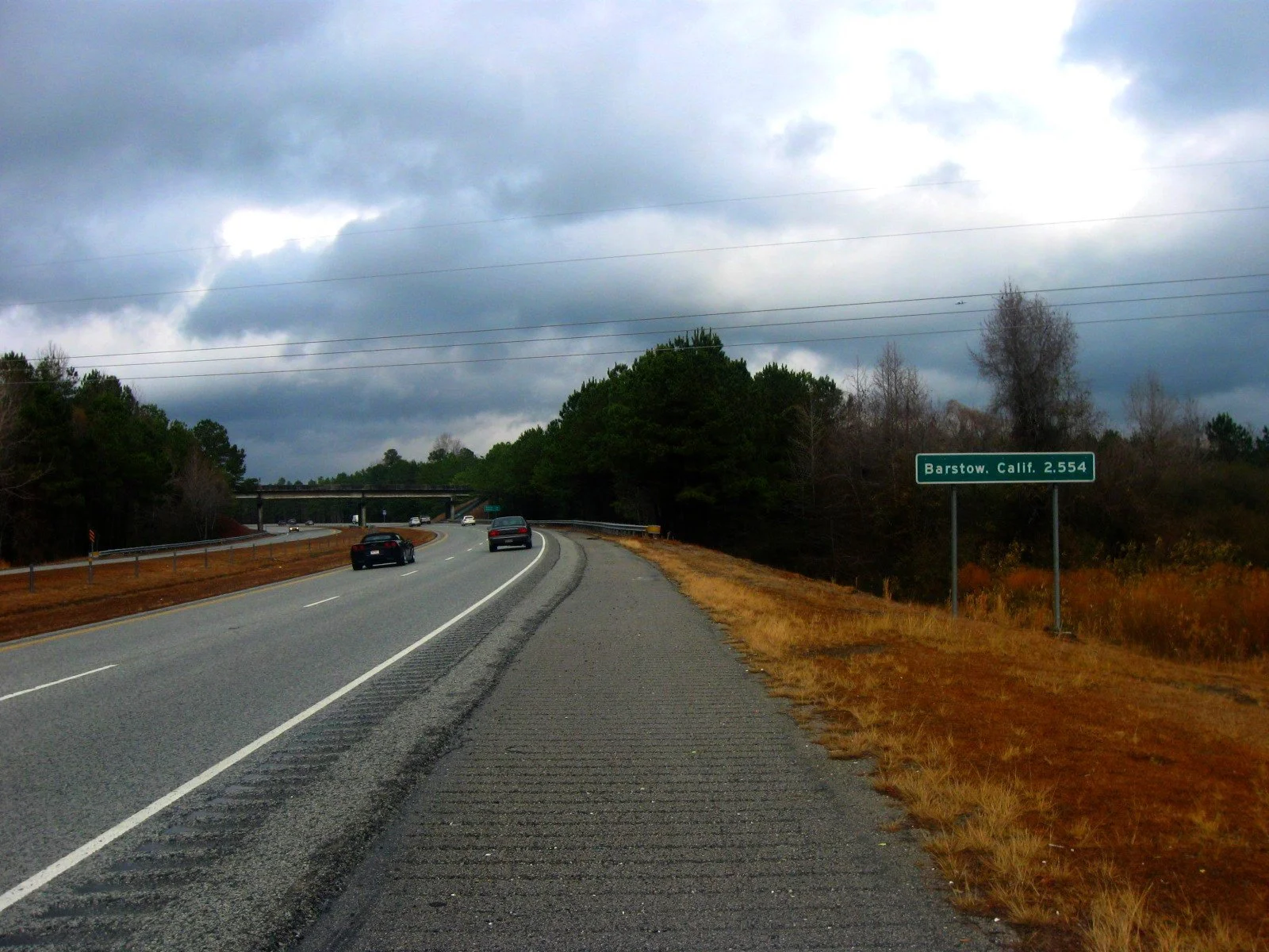 Highway sign near Wilmington, North Carolina, showing Barstow, California, 2,554 miles away along Interstate 40.