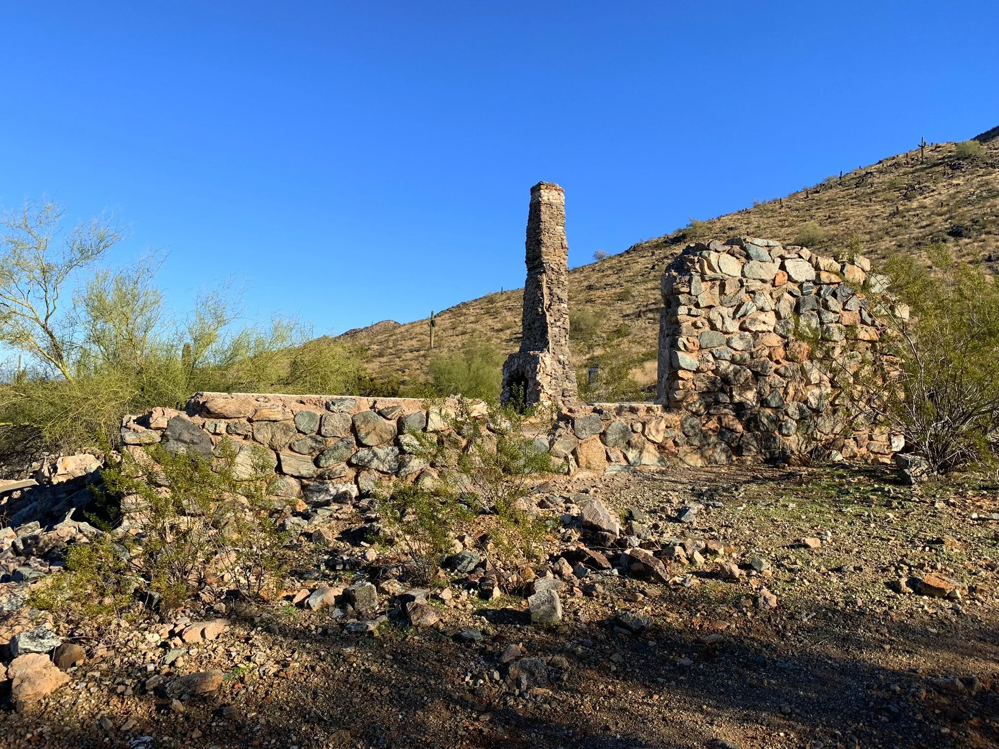 Stone walls and fireplace ruins at the historic Lost Ranch site in South Mountain Preserve.