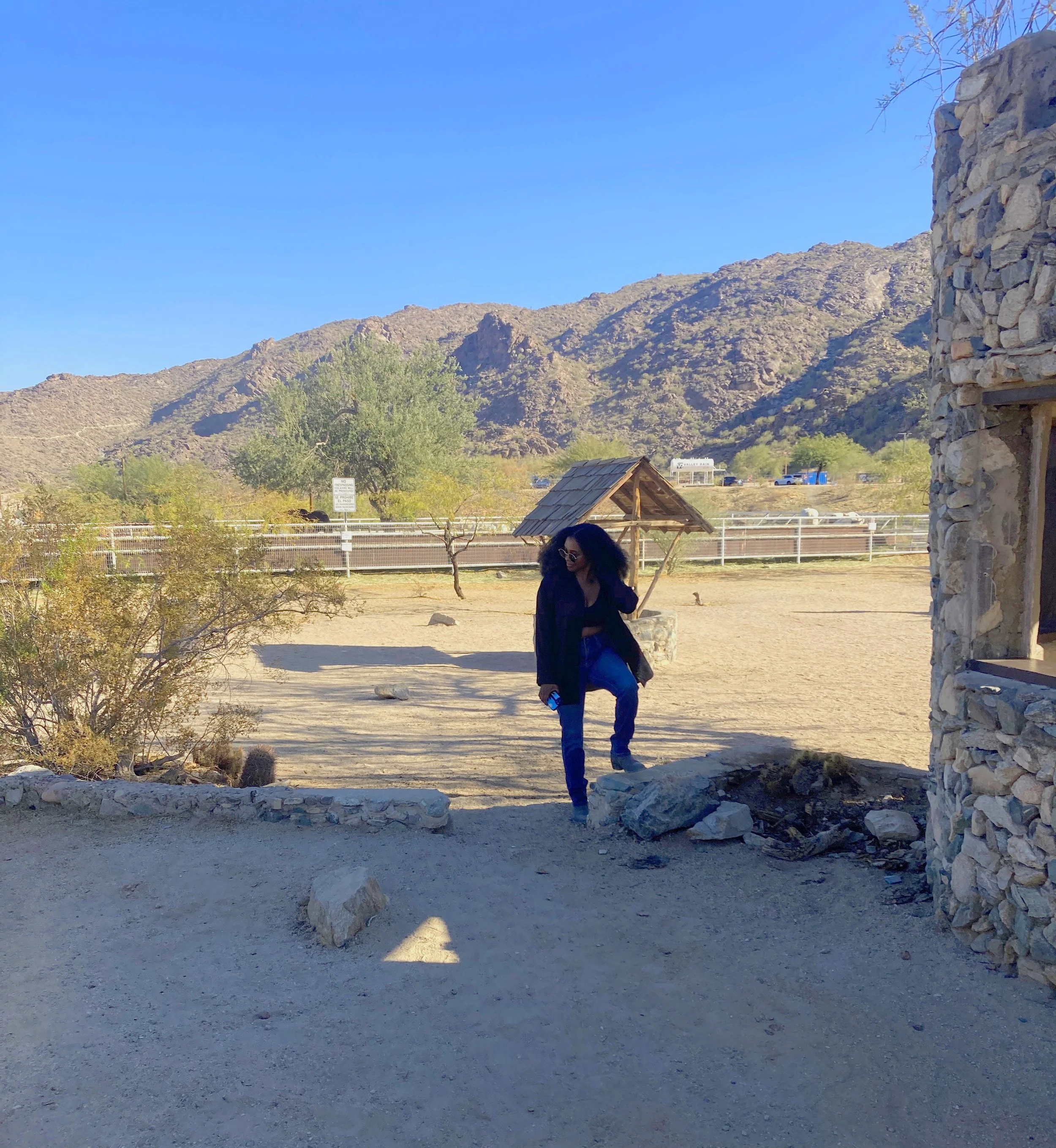 Woman standing beside the former location of Scorpion Gulch’s large saguaro after the cactus had disappeared.
