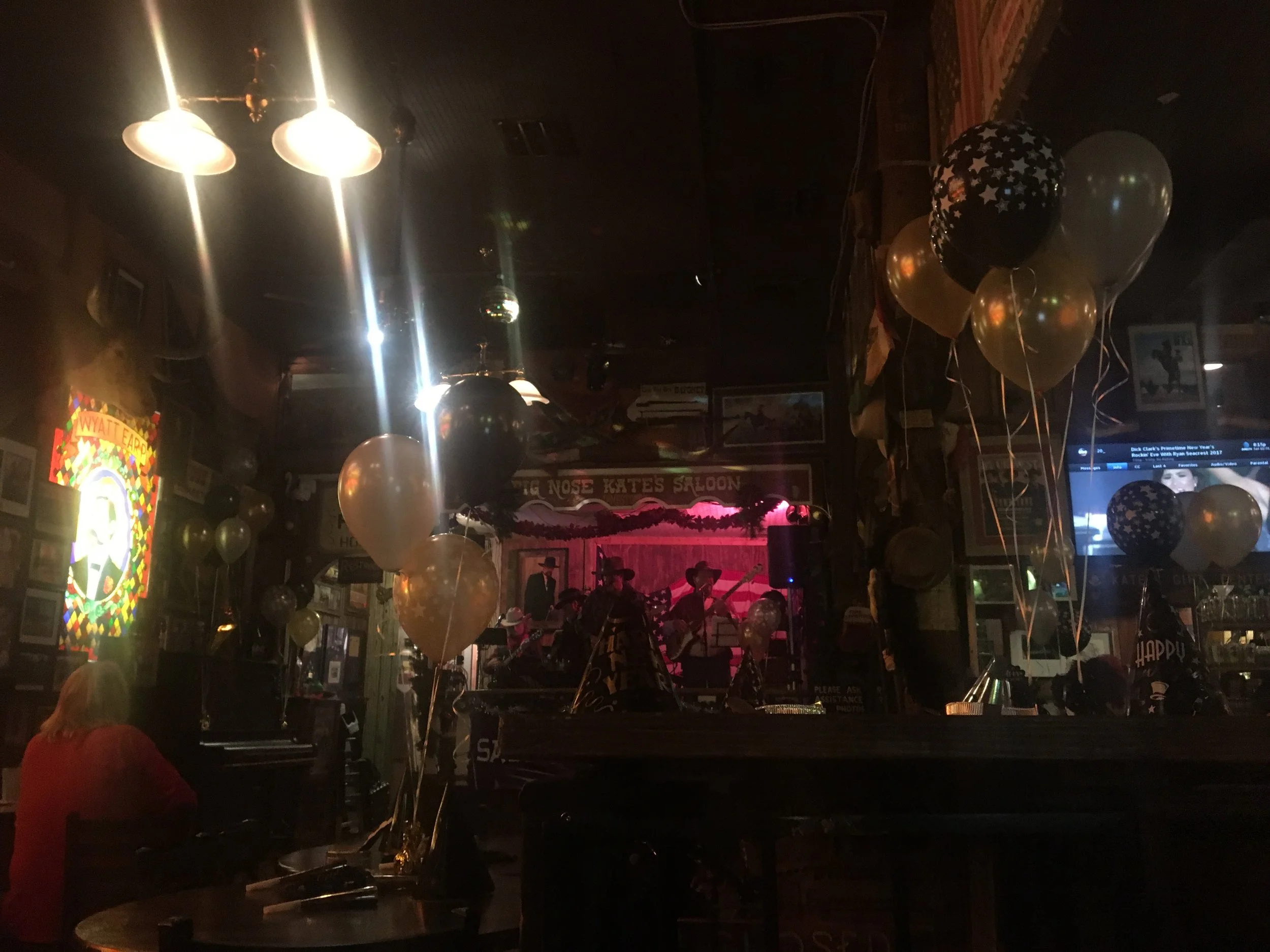 Live music performance inside Big Nose Kate’s Saloon as people celebrate New Year’s Eve in Tombstone, Arizona.