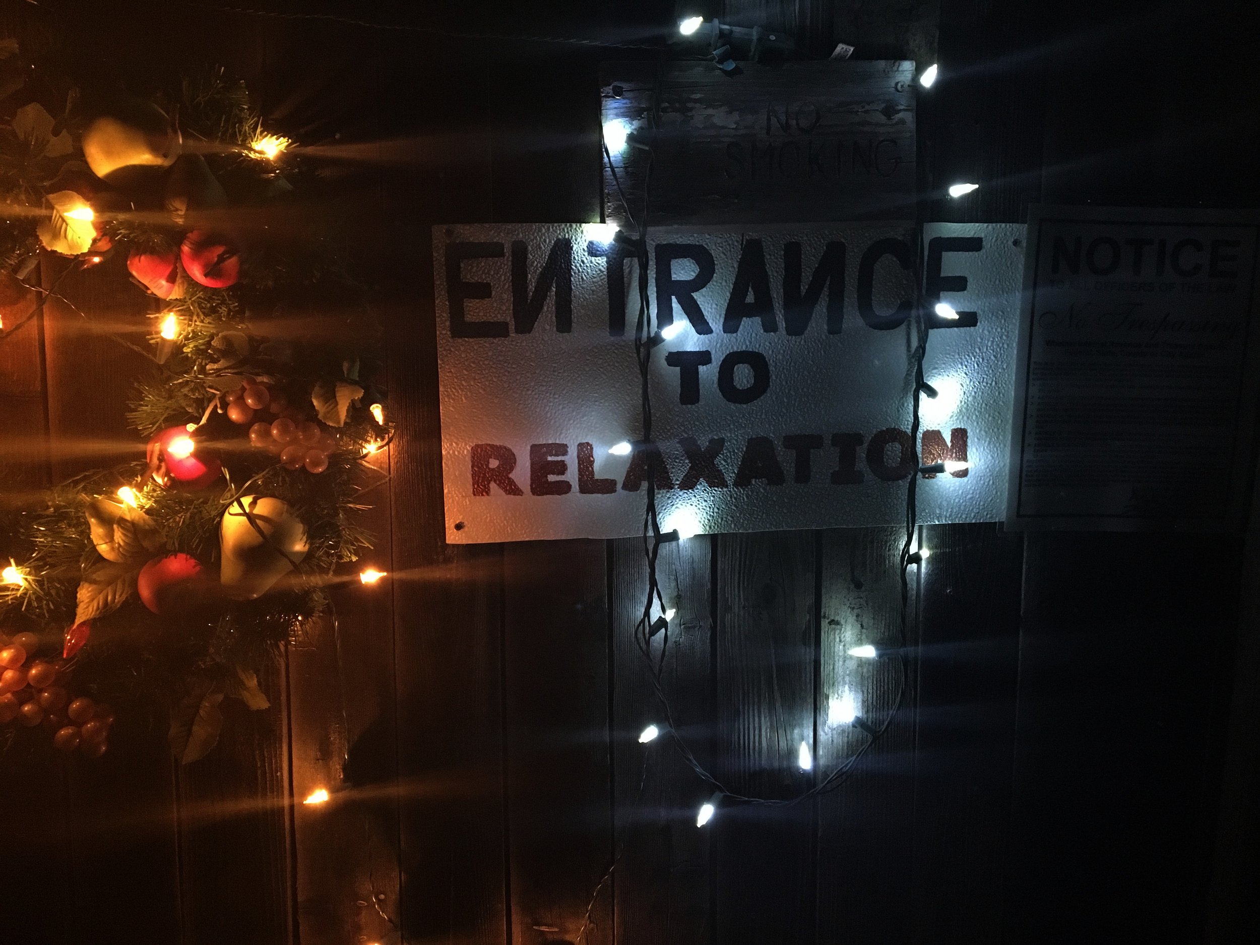 Sign reading “Entrance to Relaxation” at El Dorado Hot Springs in Arizona.