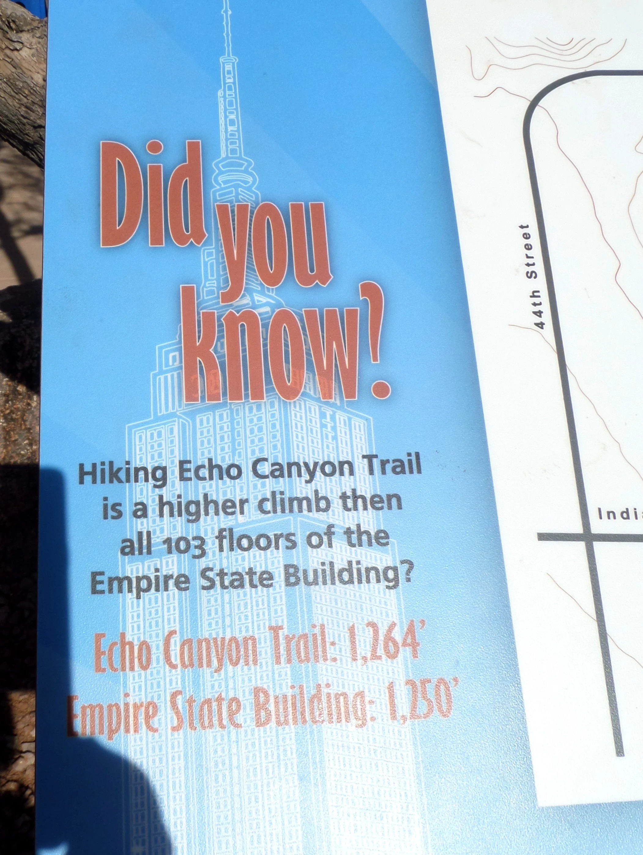 Sign comparing Camelback Mountain’s Echo Canyon Trail elevation gain to the Empire State Building.