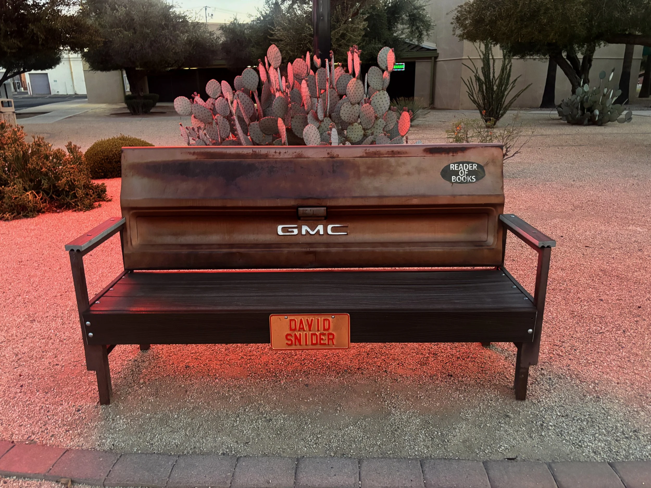 Vintage GMC truck tailgate repurposed into a bench by artist David Snider in Casa Grande, Arizona.