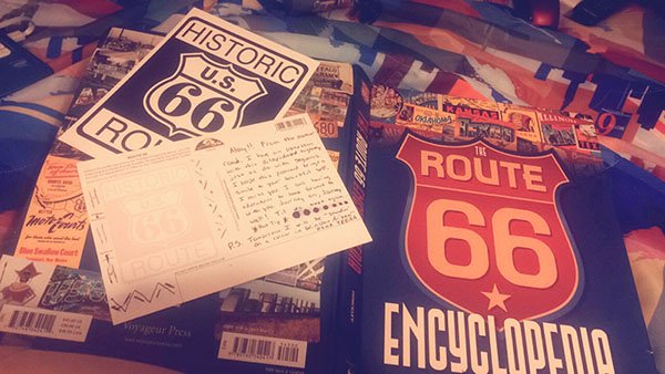 Writing a postcard to send from Route66 in Winslow, Arizona.