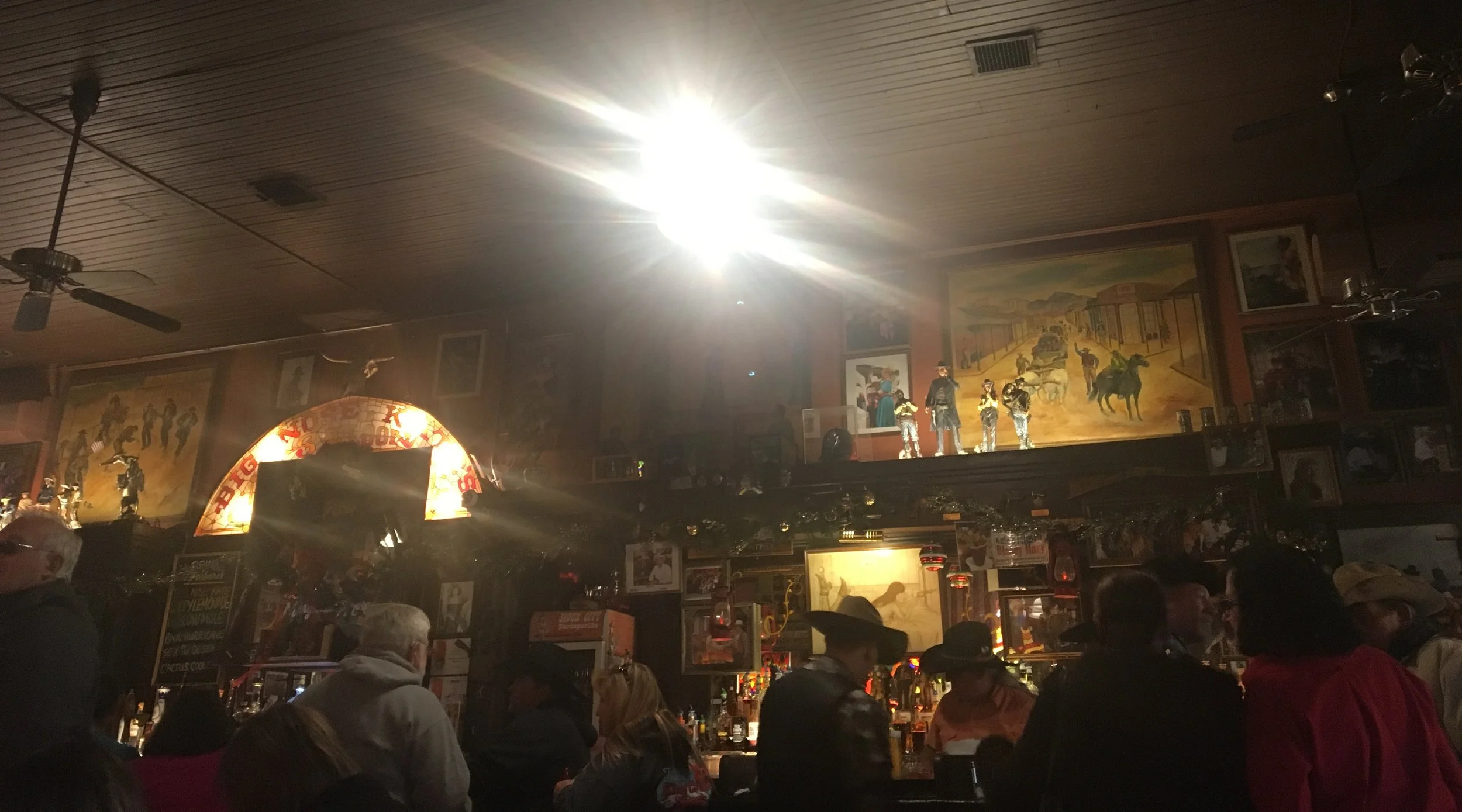 Interior view of Big Nose Kate’s Saloon in Tombstone, Arizona, showing the bar, décor, and gathering space