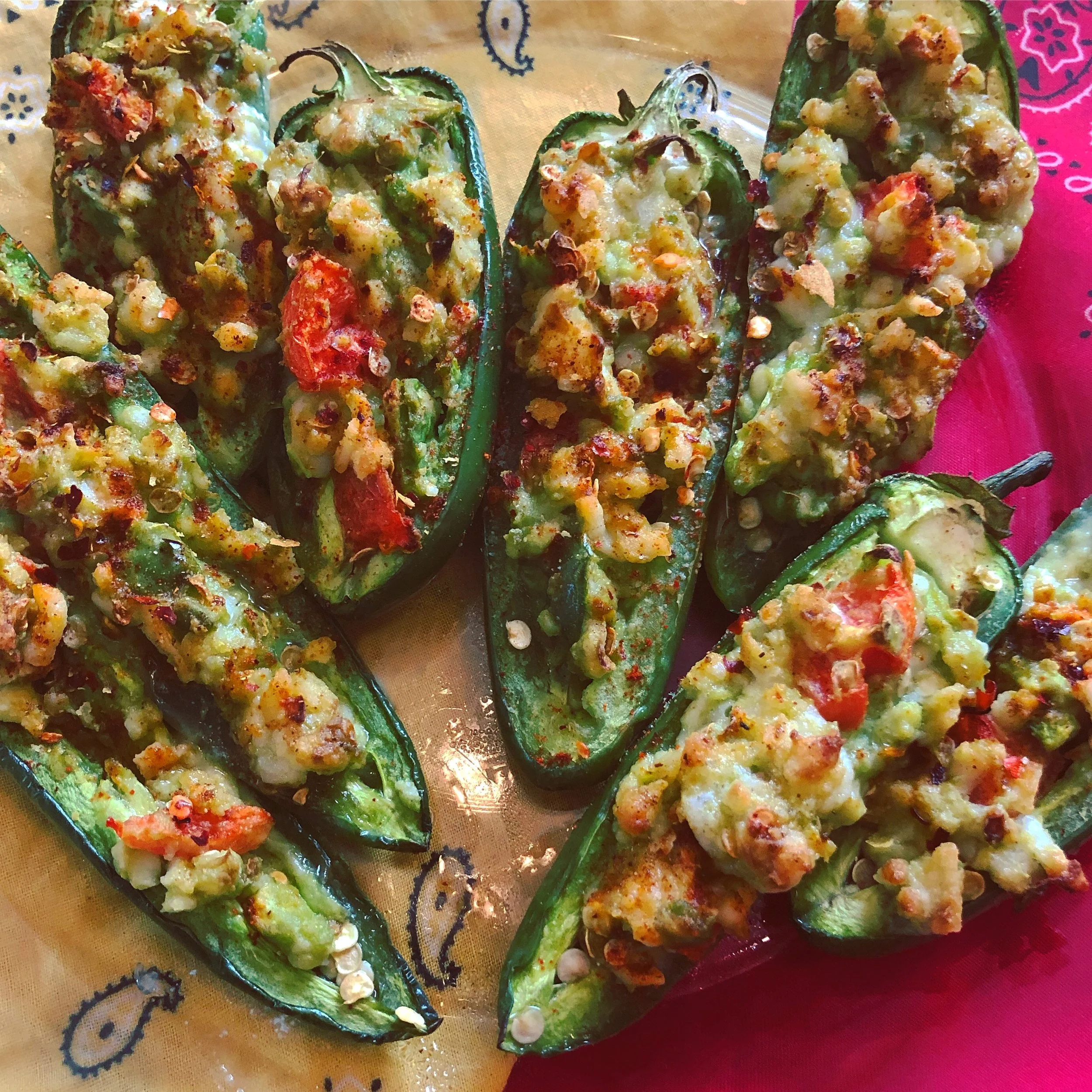 Southwest-style loaded stuffed peppers topped with dairy-free cheese, chiles, and fresh toppings.