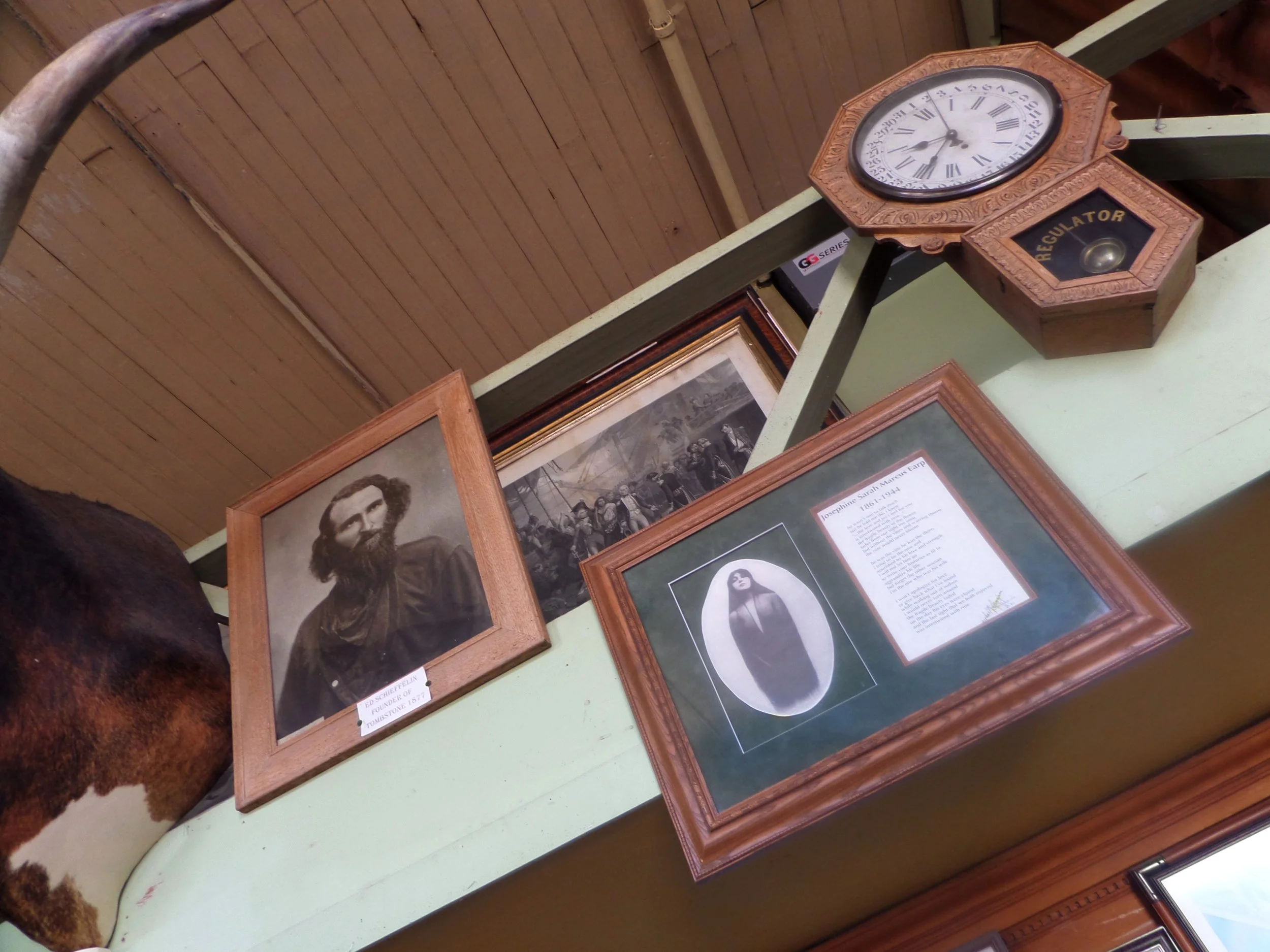 Old photos on the wall inside of the Bird Cage Theatre in Tombstone, Arizona