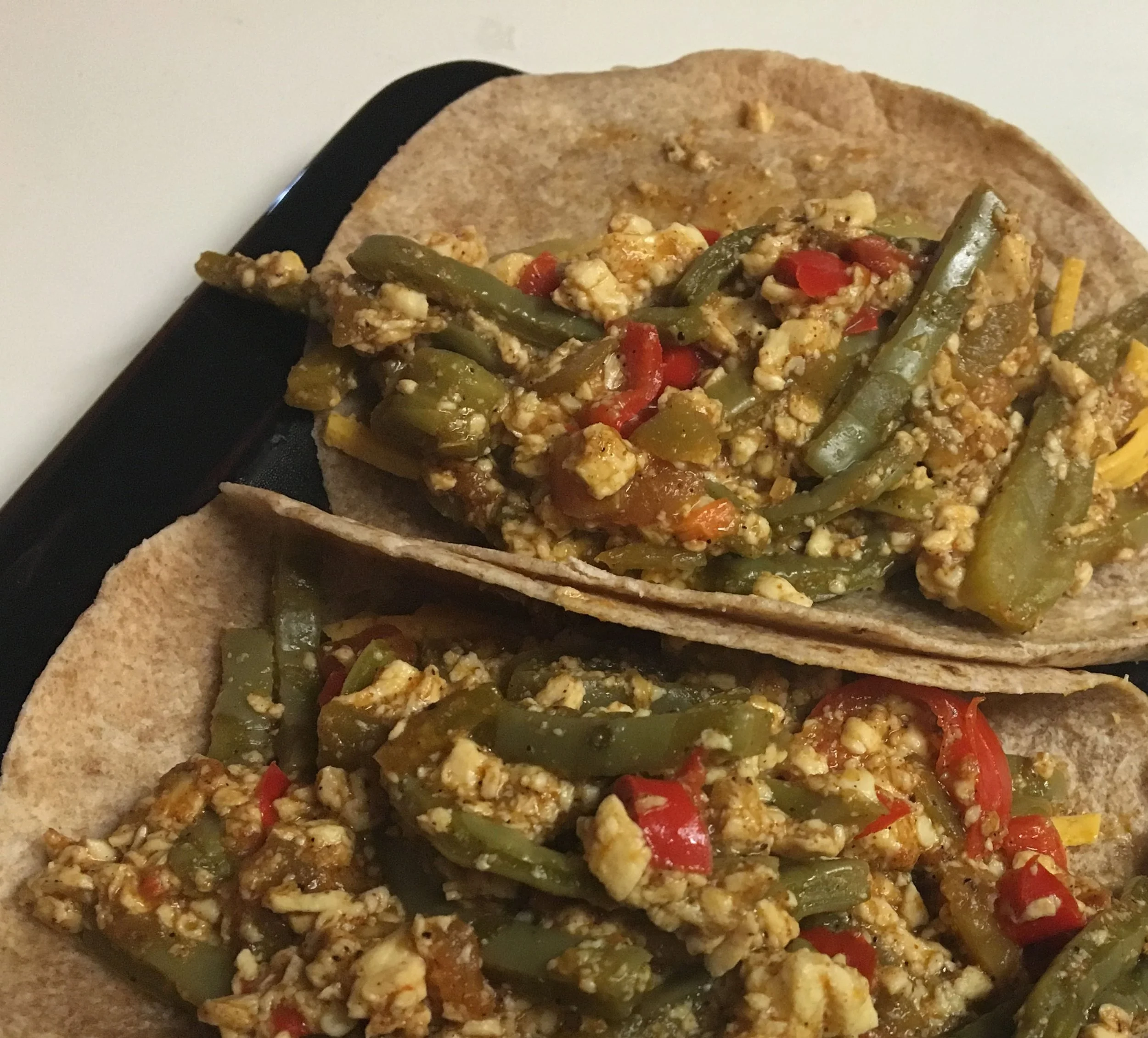 Vegan breakfast tacos made with cactus, peppers, and fresh vegetables for a flavorful Southwest-inspired meal.