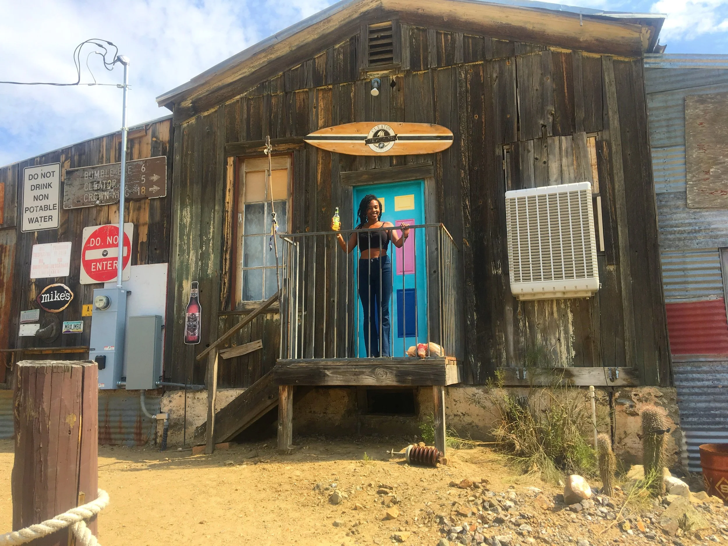 Historic wooden building with colorful door at the Cleator Yacht Club in Arizona.