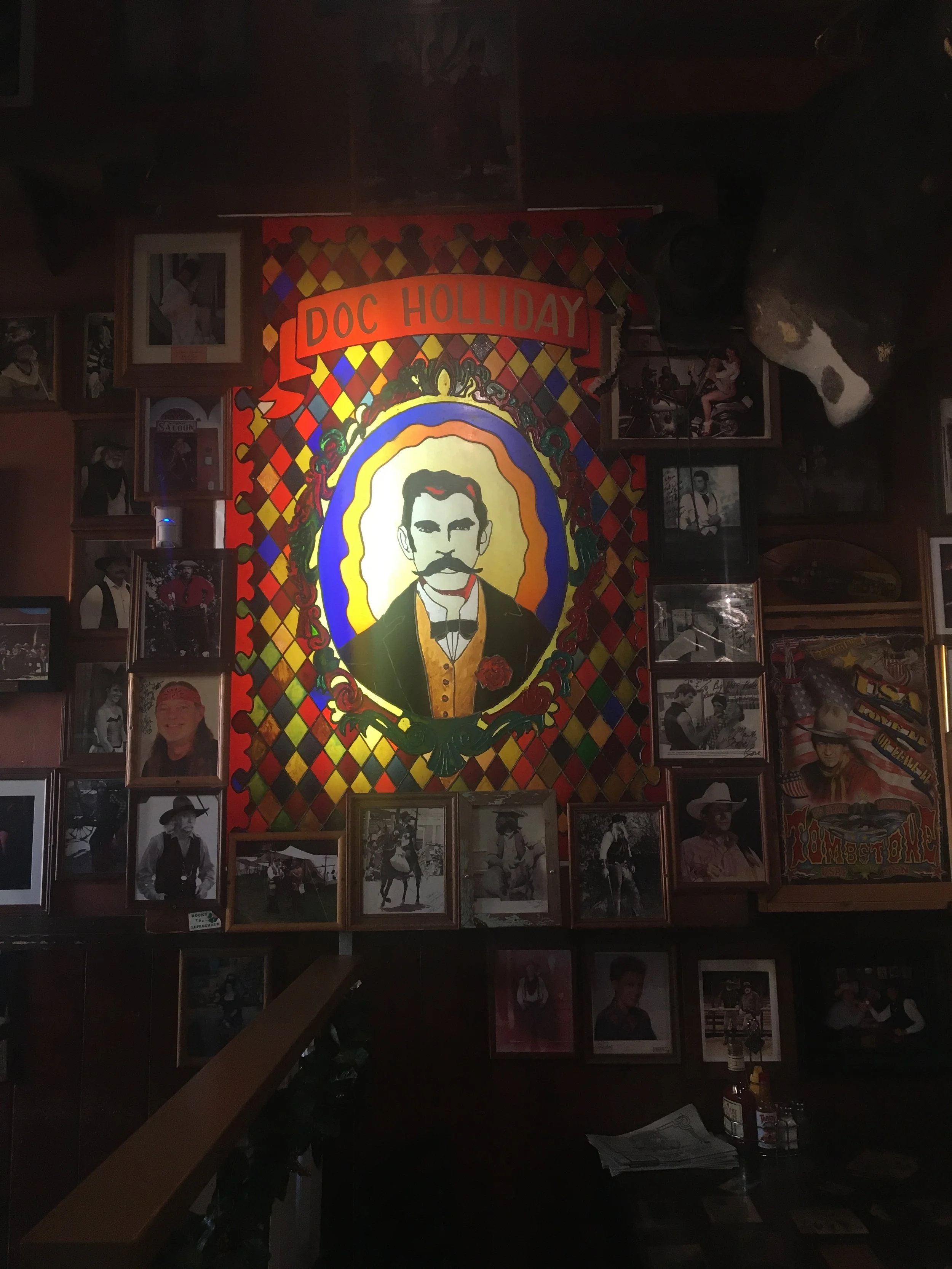 Stained-glass style artwork of Doc Holliday glowing inside Big Nose Kate’s Saloon in Tombstone, Arizona.