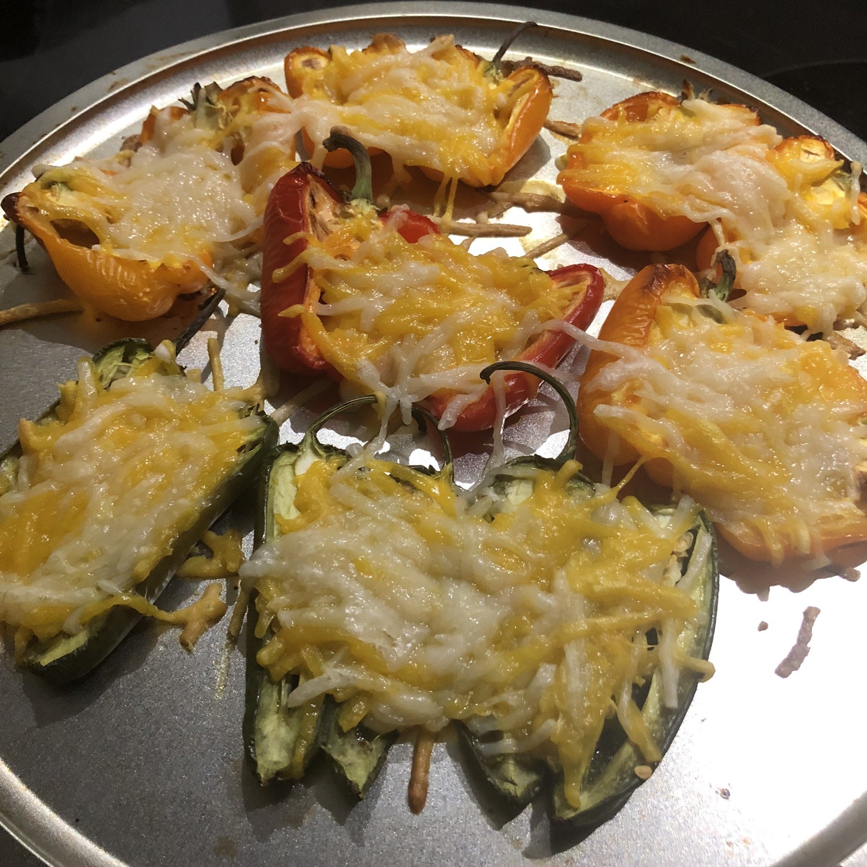 Assorted baked peppers topped with melted vegan cheese and Southwest-inspired seasonings.
