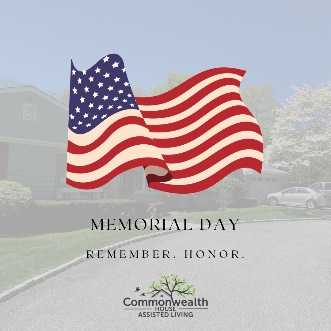 American flag waving in front of a suburban neighborhood with memorial day text and Commonwealth House Assisted Living logo.