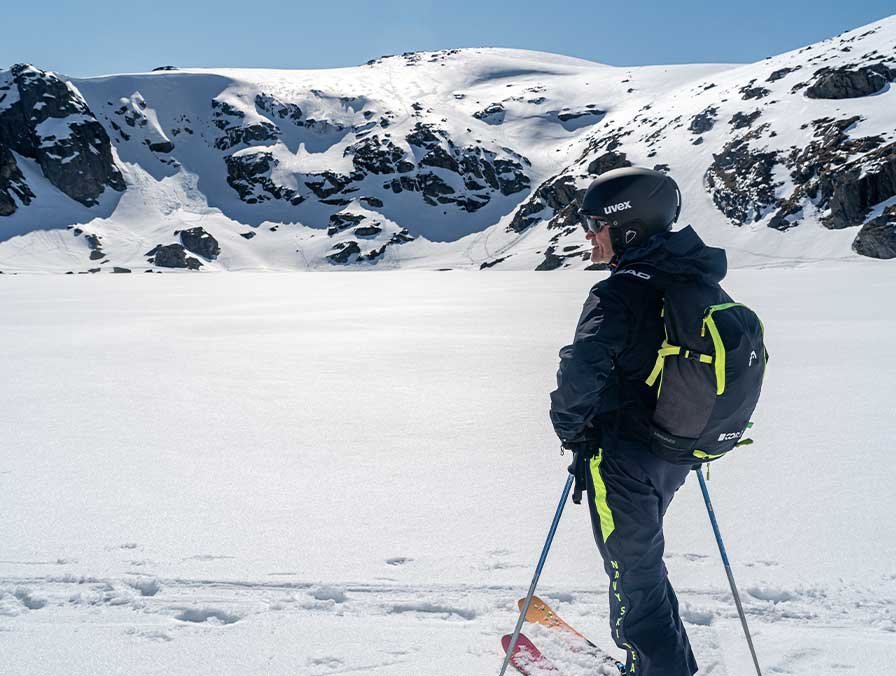 Skinning the Main Range with views to forested peaks