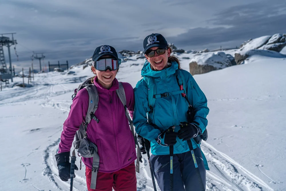 Two guests smiling on a K7 backcountry tour