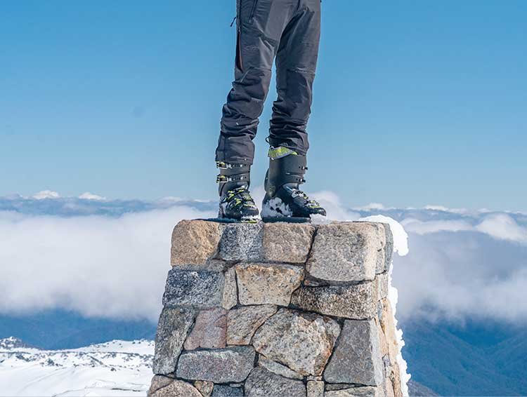 Summit marker atop Mt Kosciuszko in winter