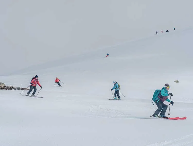 Group skiing on the Main Range towards Mt Kosciuszko