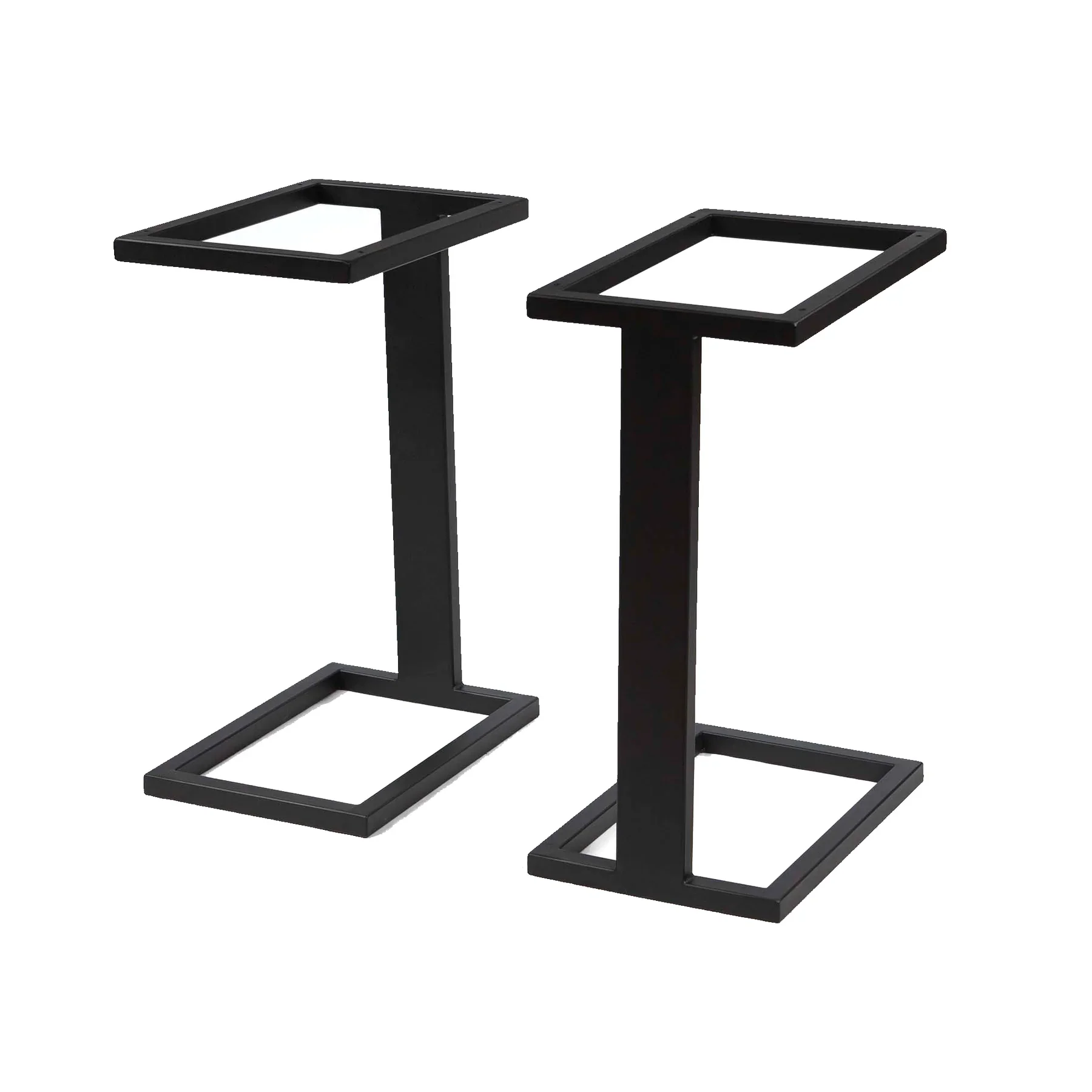 Two black metal table bases with rectangular frames and central support columns.