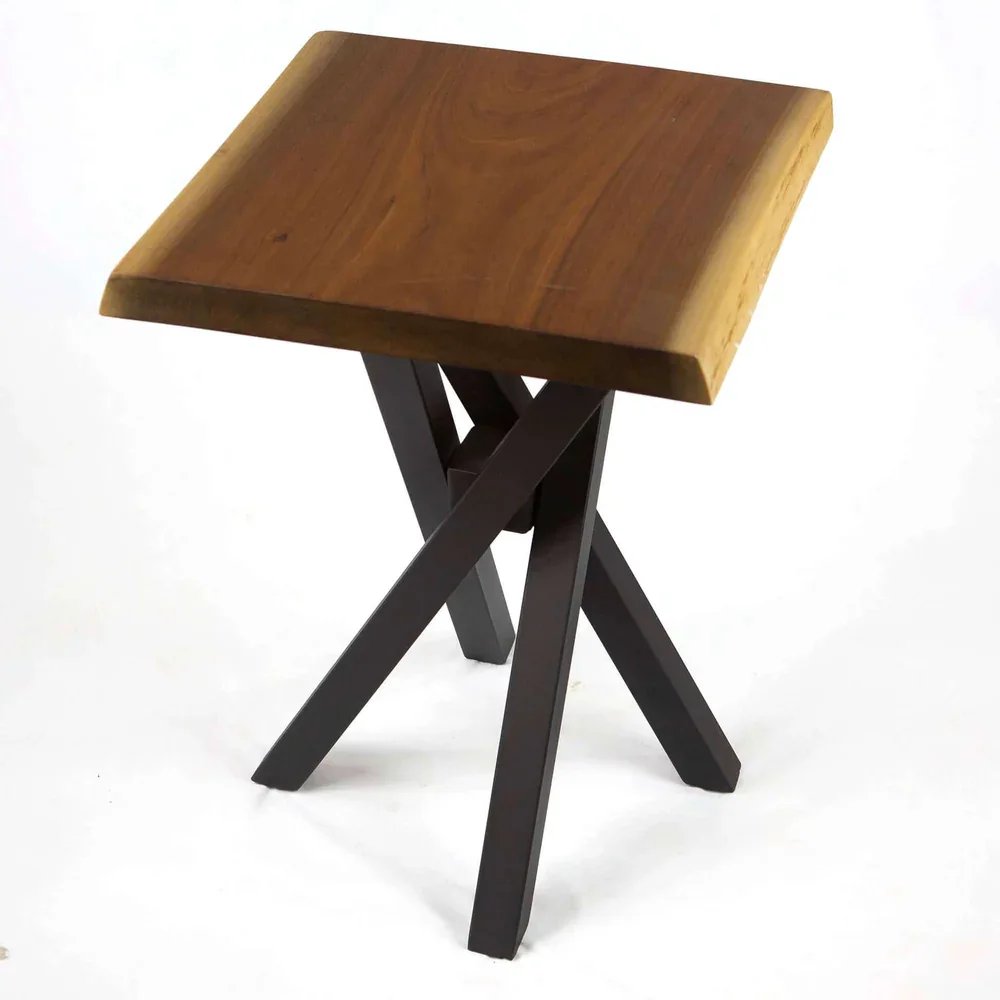 A small wooden side table with a square top and black crossed legs.