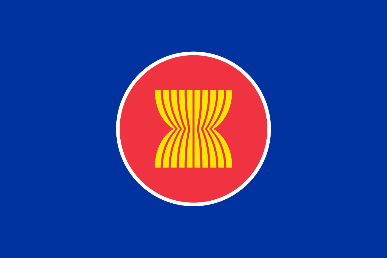 Flag highlighting IGNITE Performance delivery capability in the ASEAN region of Asia with a red field, a blue canton, and a central yellow stylized sun with rays.