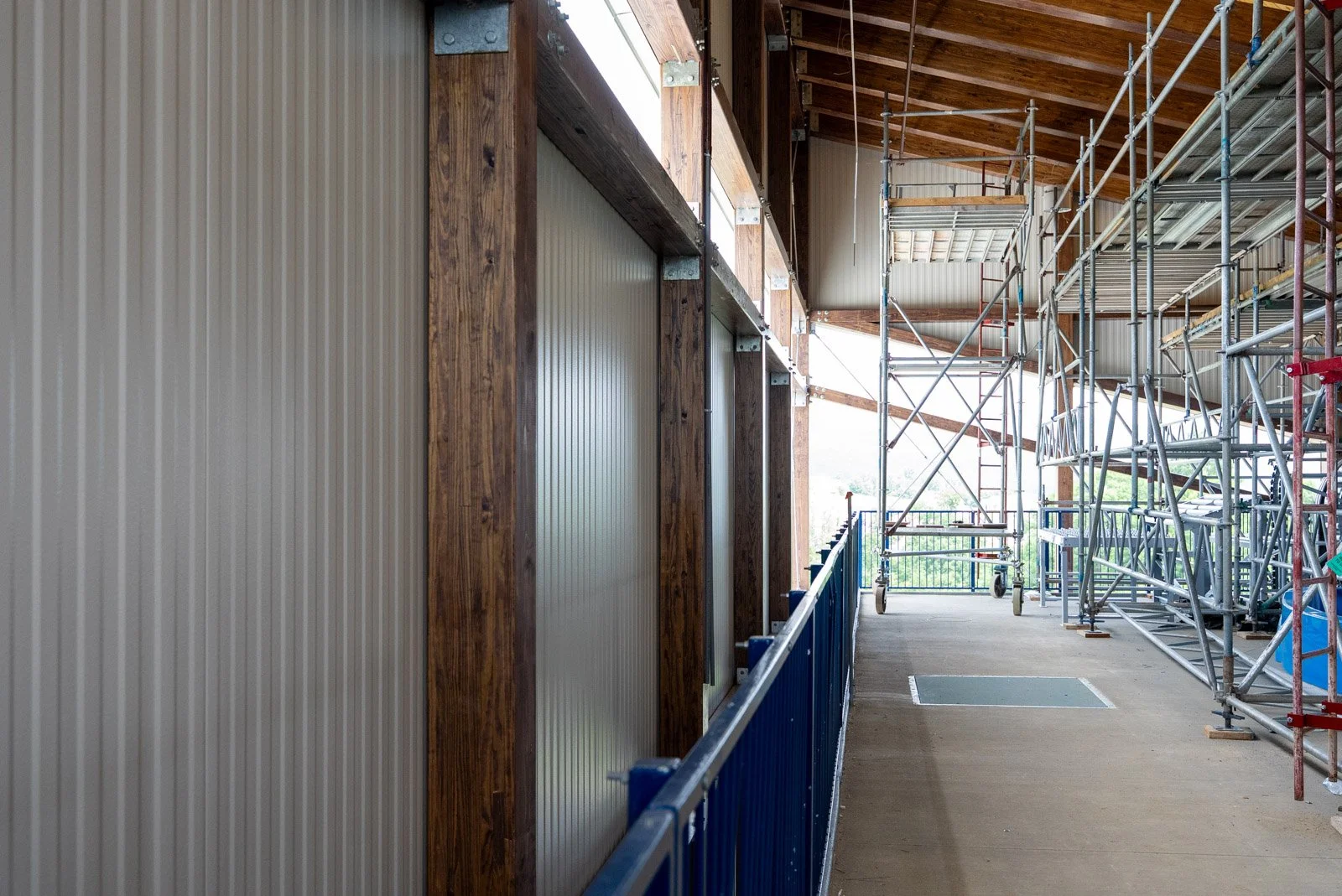 Detail of insulated metal panel installation against glulam timber beams inside the Massanutten Water Park stair tower